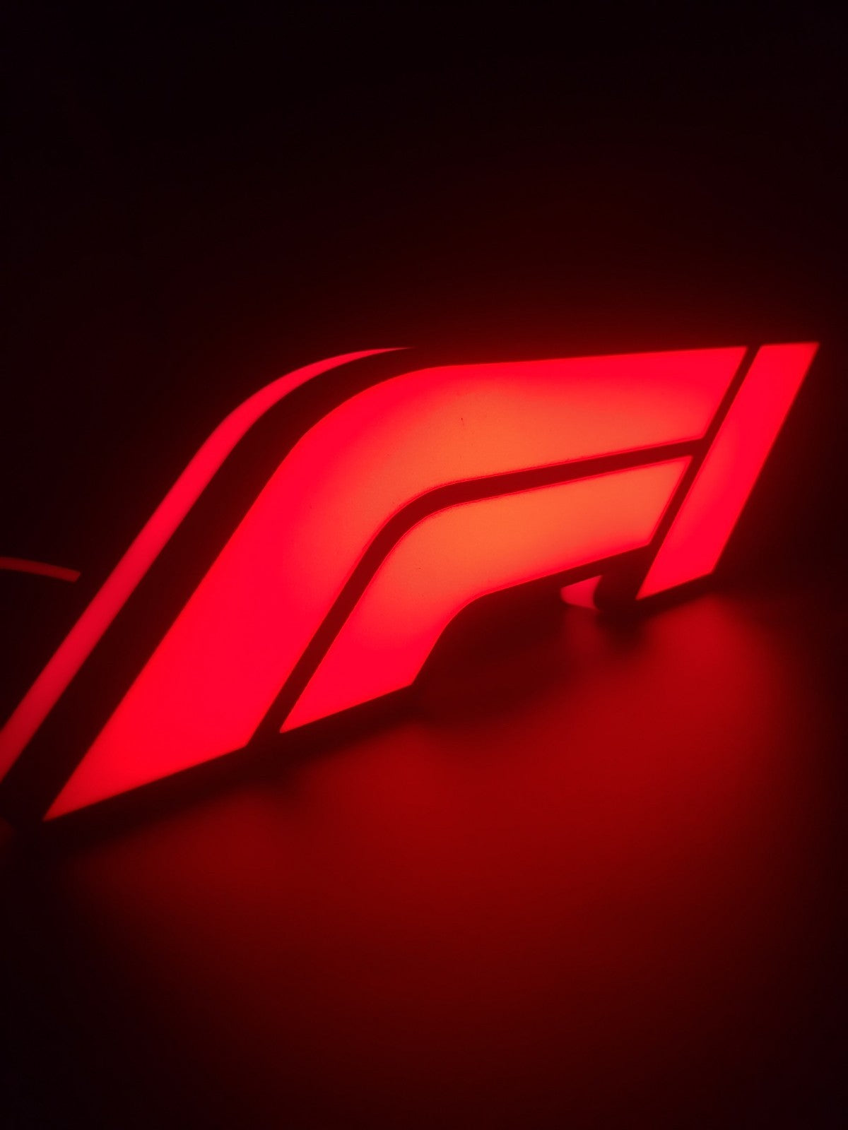 F1 led light sign with illuminated logo viewed from side view