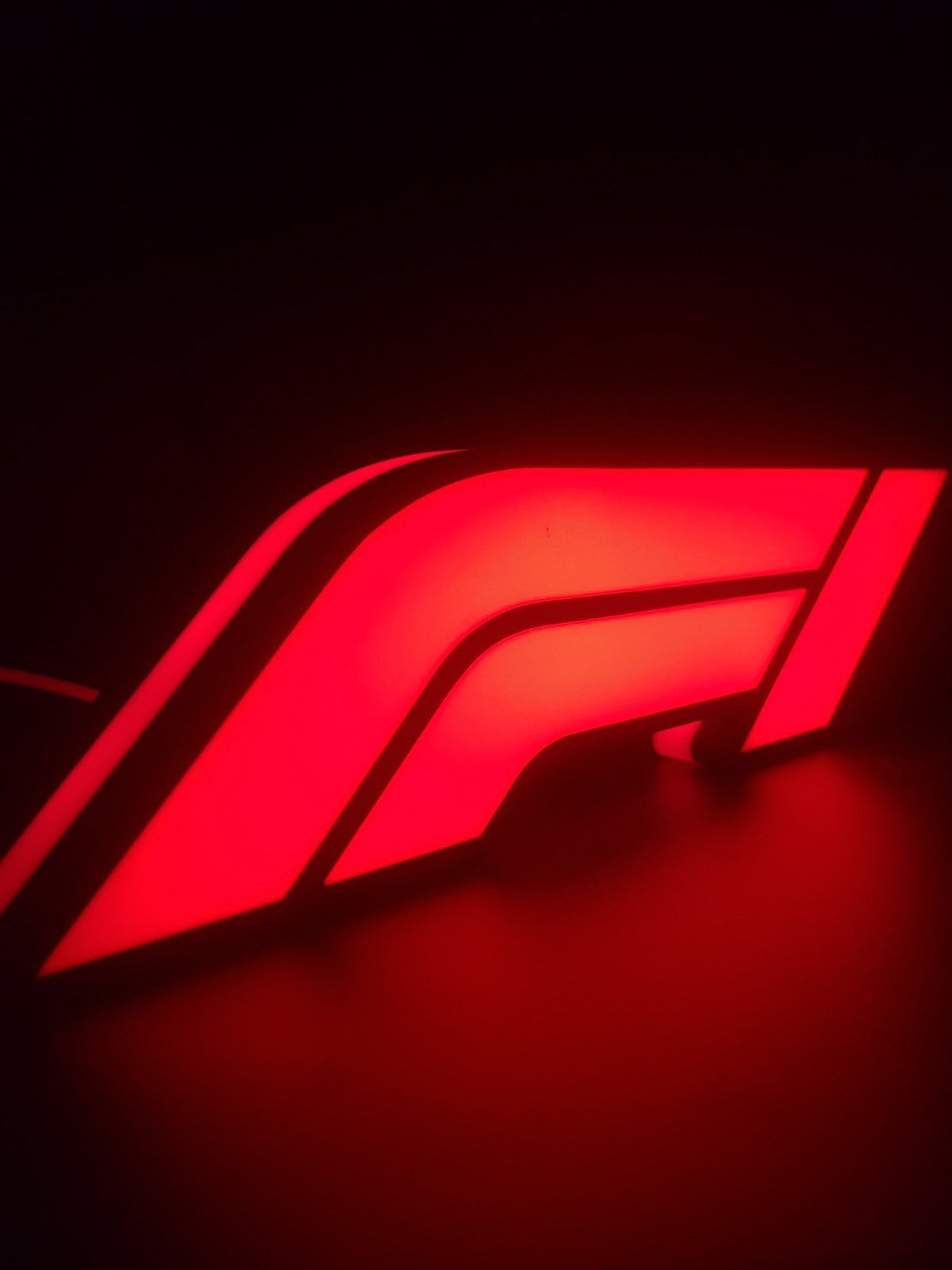 F1 led light sign with illuminated logo viewed from side view