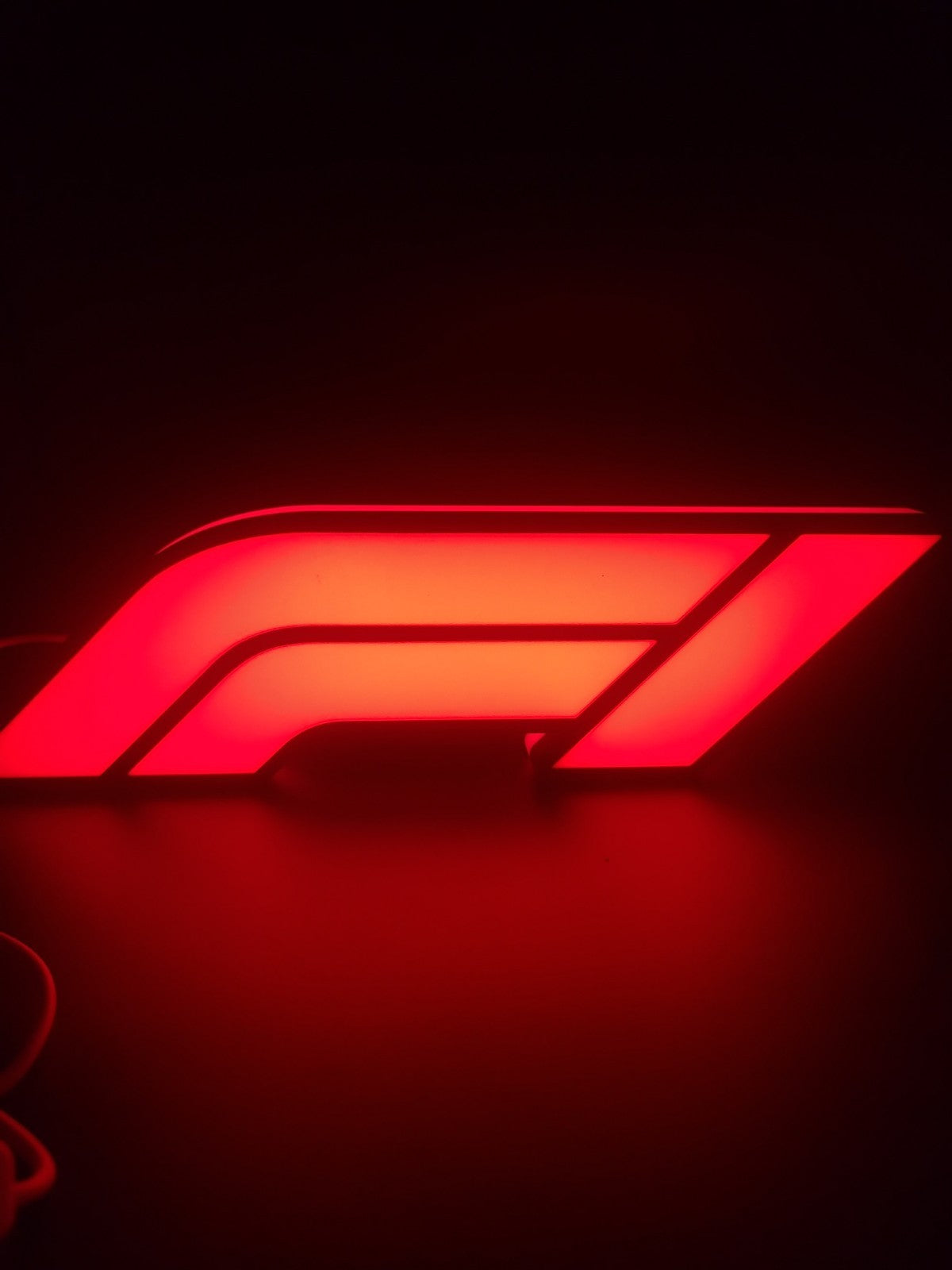 F1 led light sign with illuminated logo viewed from straight on 