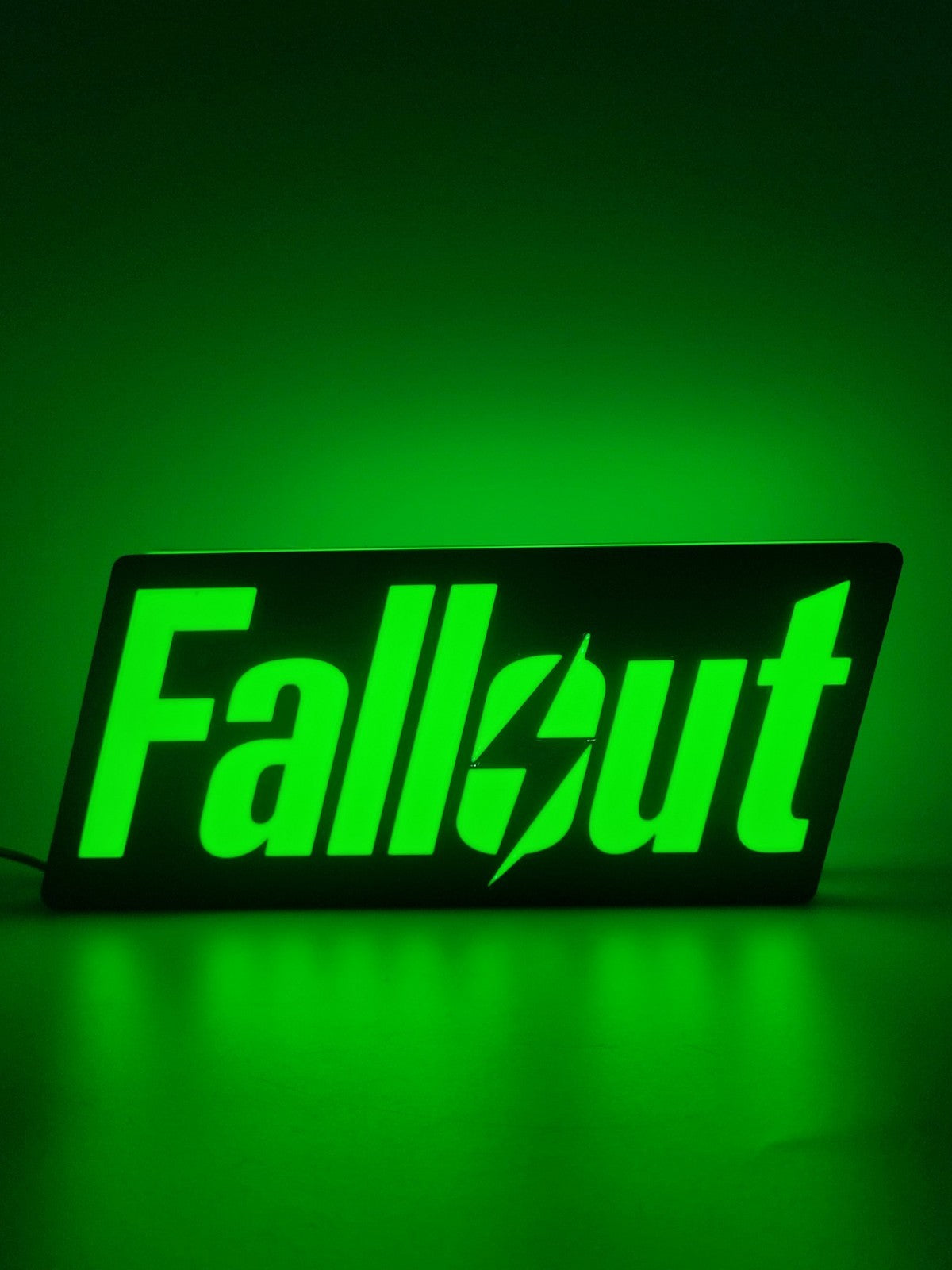 Fallout LED light sign with illuminated logo viewed from straight on