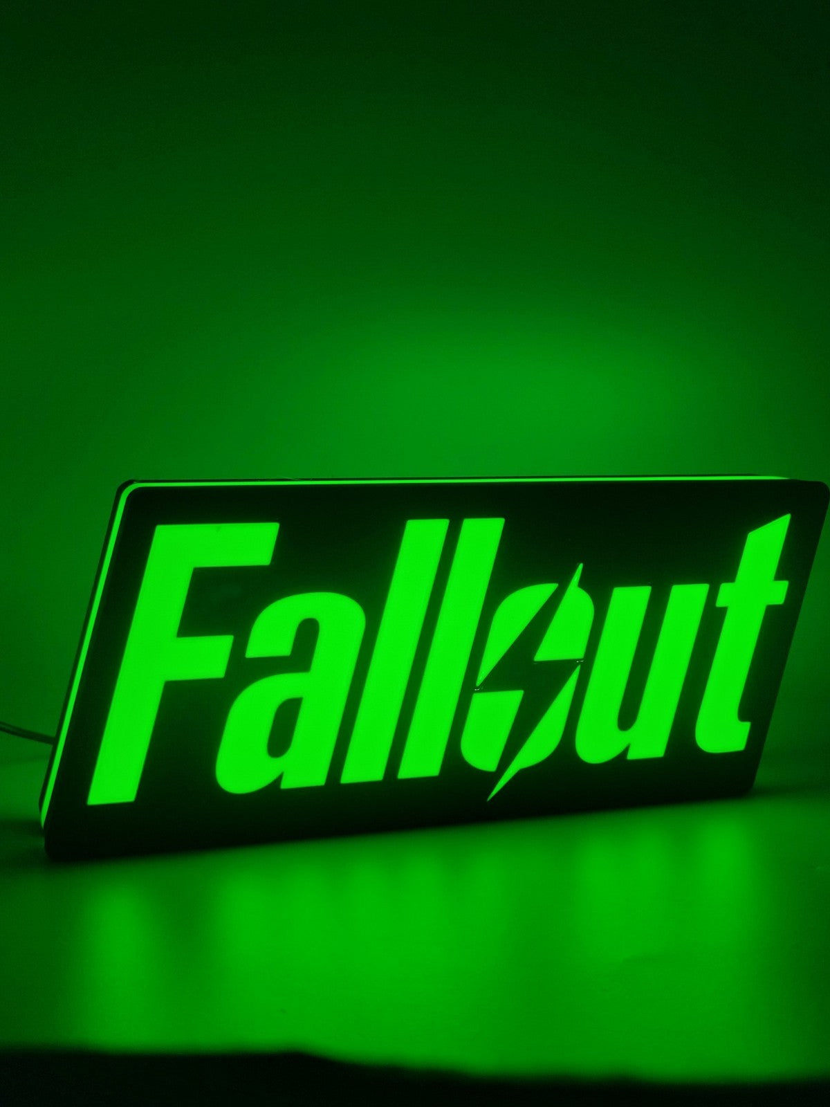 Fallout LED light sign with illuminated logo viewed from side view