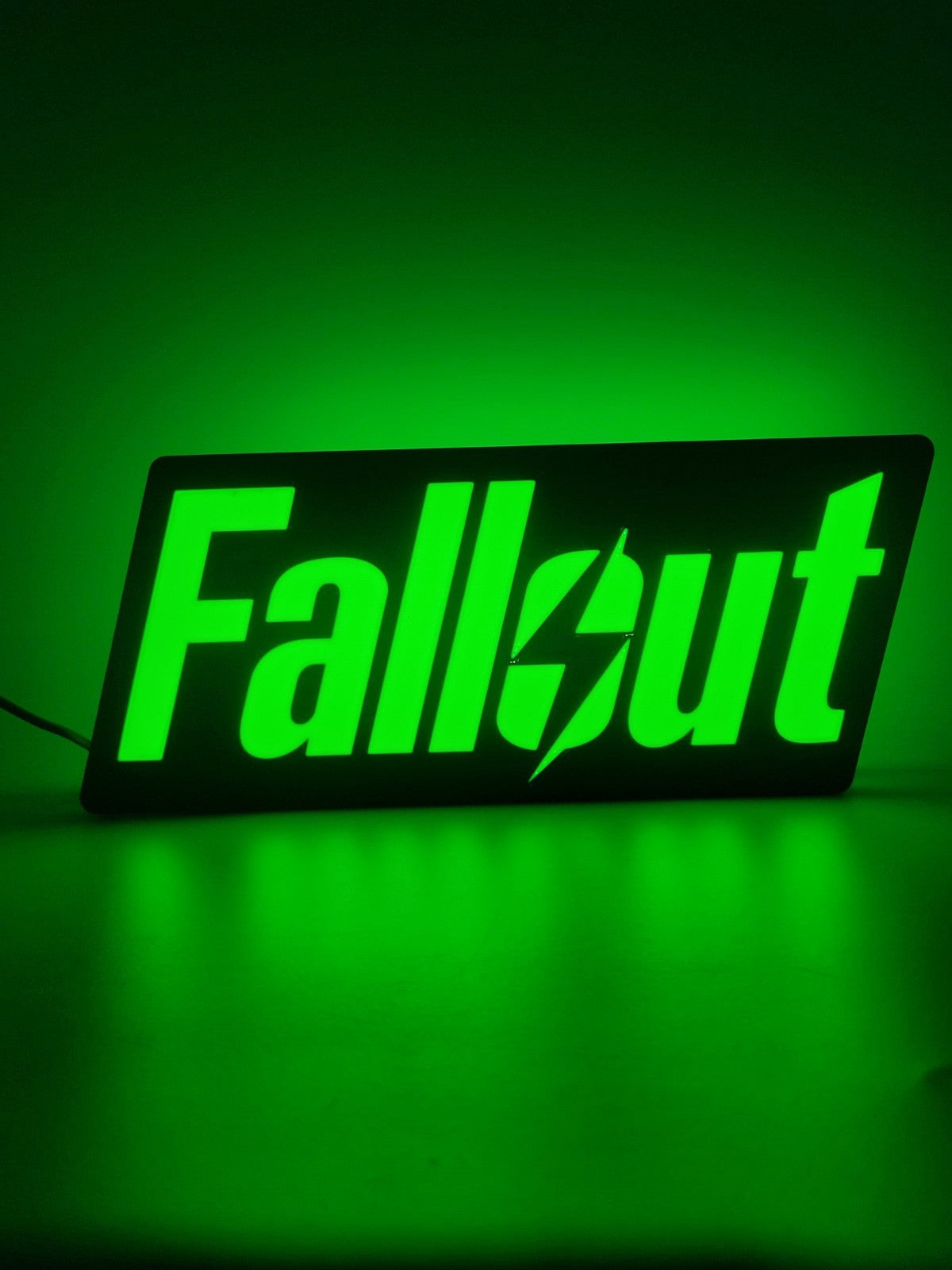 Fallout LED light sign with illuminated logo viewed from straight on