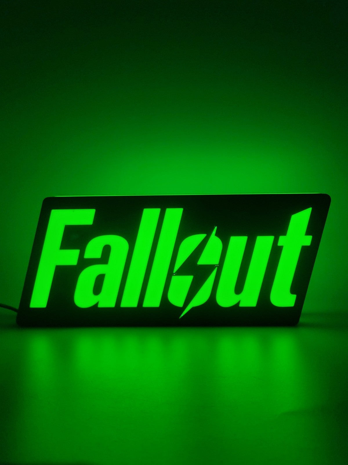 Fallout LED light sign with illuminated logo viewed from straight on