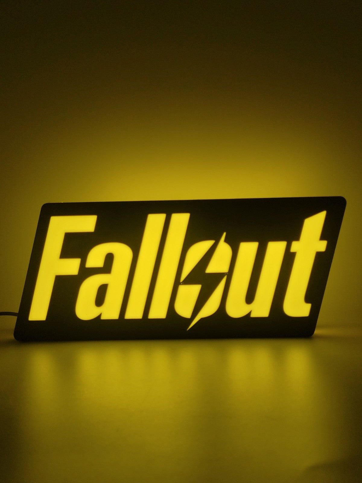 Fallout LED light sign with illuminated logo viewed from straight on