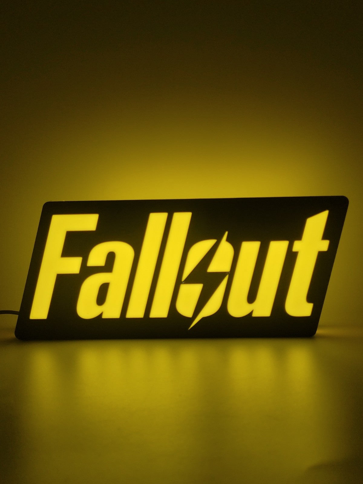 Fallout LED light sign with illuminated logo viewed from straight on
