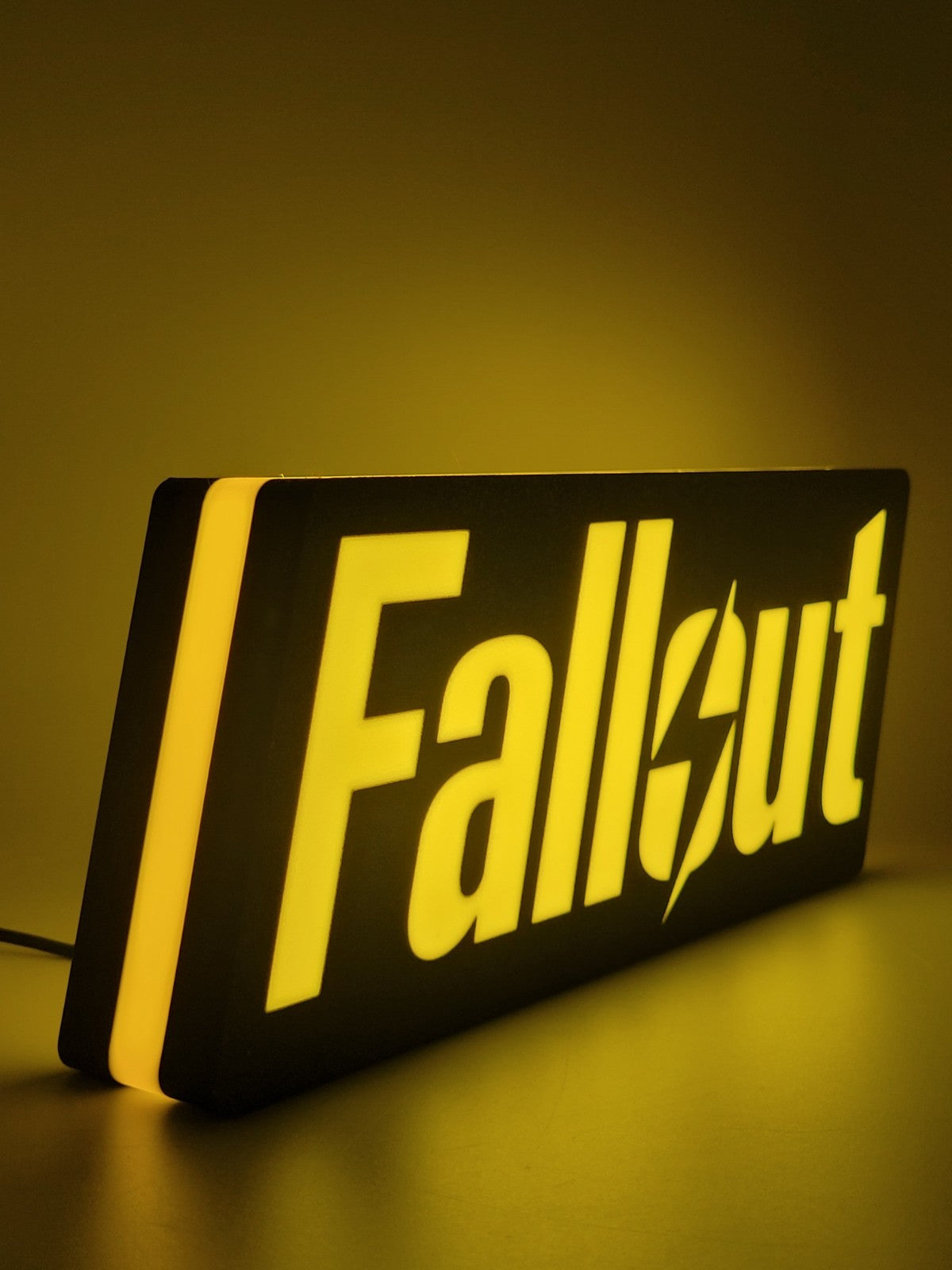 Fallout LED light sign with illuminated logo viewed from side view