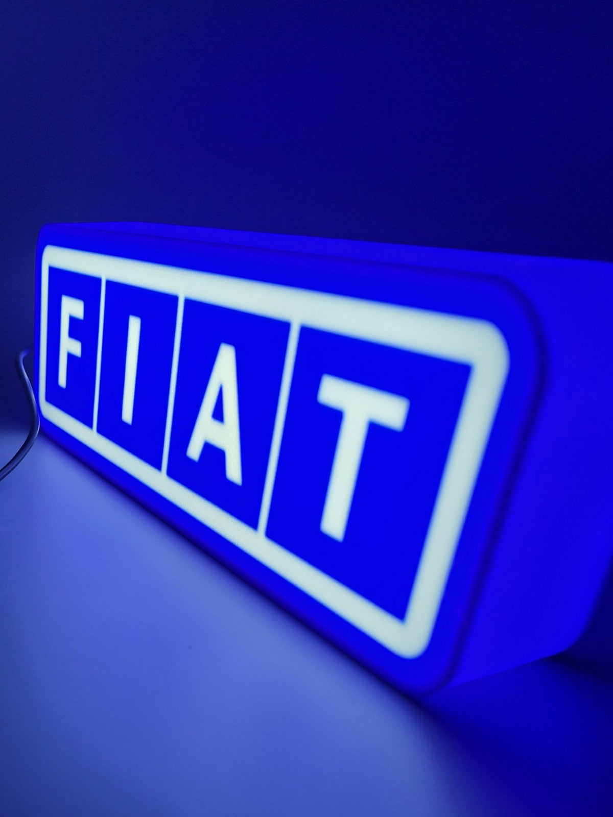 FIAT led light sign with illuminated logo viewed from side view