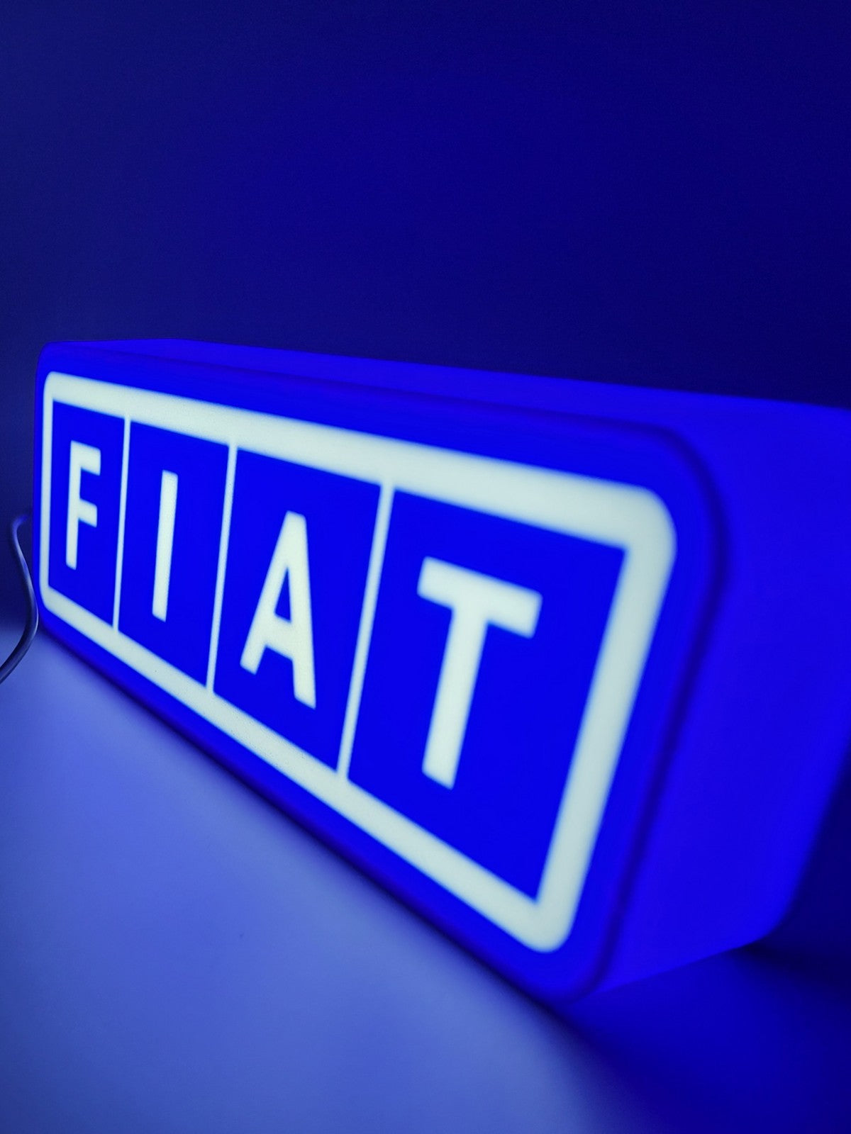 FIAT led light sign with illuminated logo viewed from side view