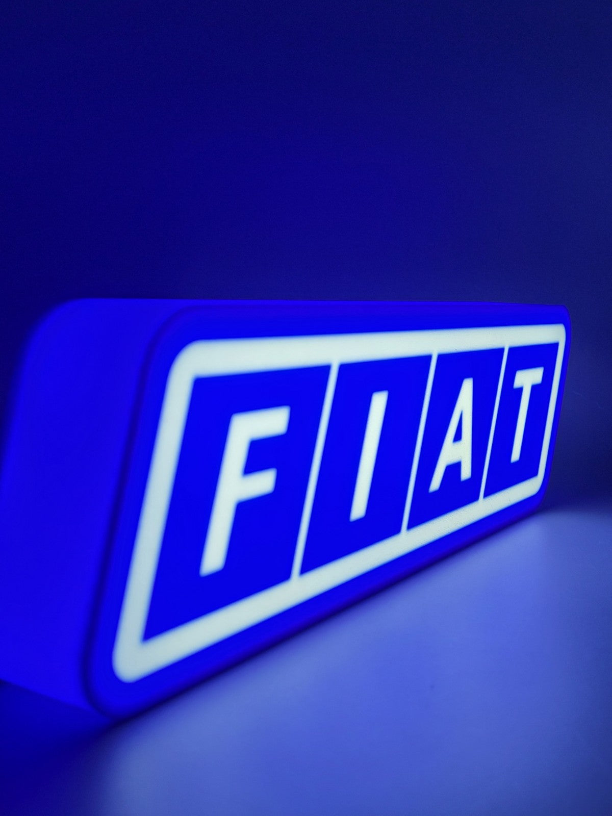 FIAT led light sign with illuminated logo viewed from side view