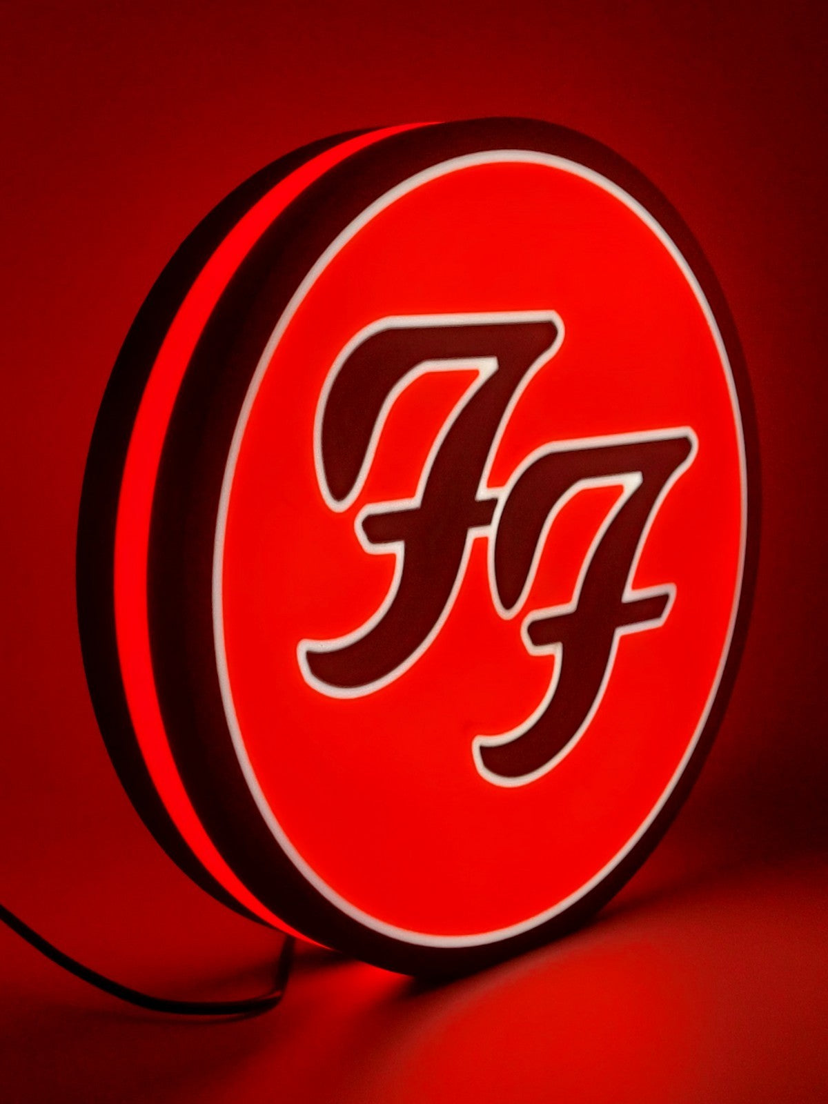 foo fighters led light sign with illuminated logo viewed from side view