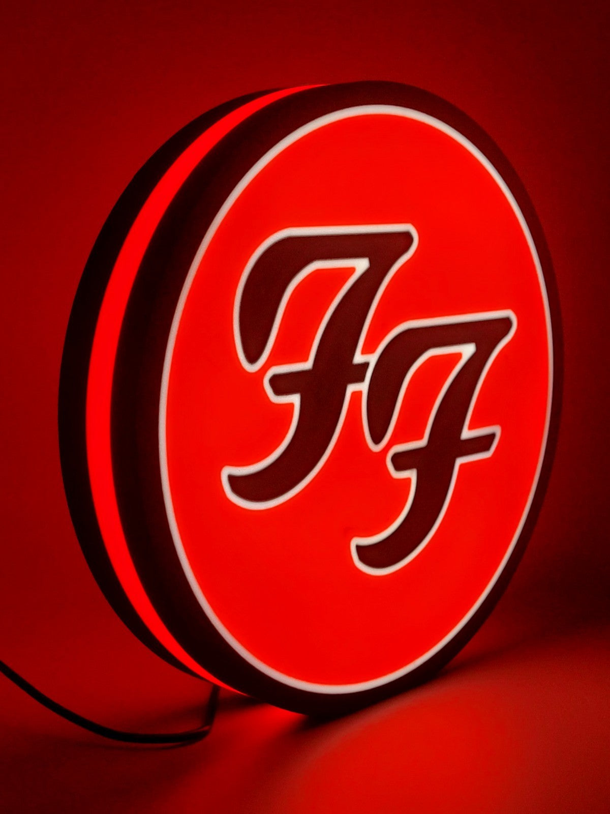 foo fighters led light sign with illuminated logo viewed from side view
