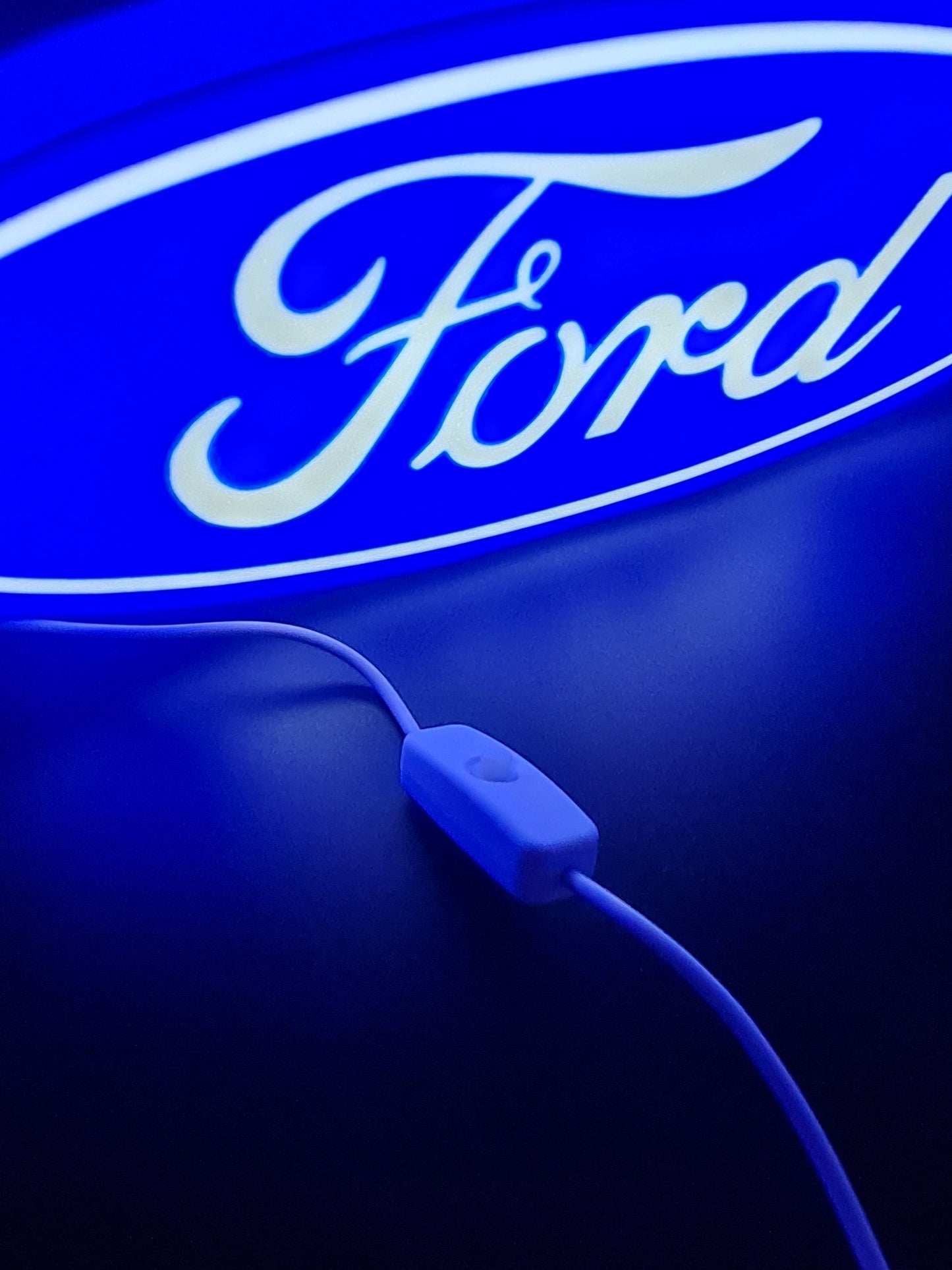 ford led light sign with illuminated logo viewed from side view