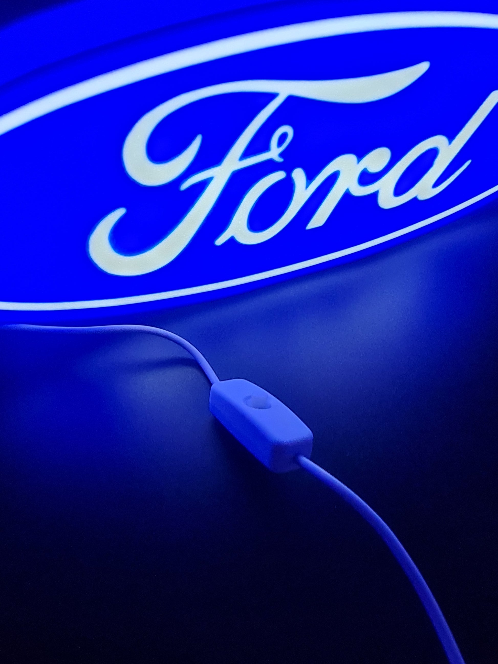 ford led light sign with illuminated logo viewed from side view