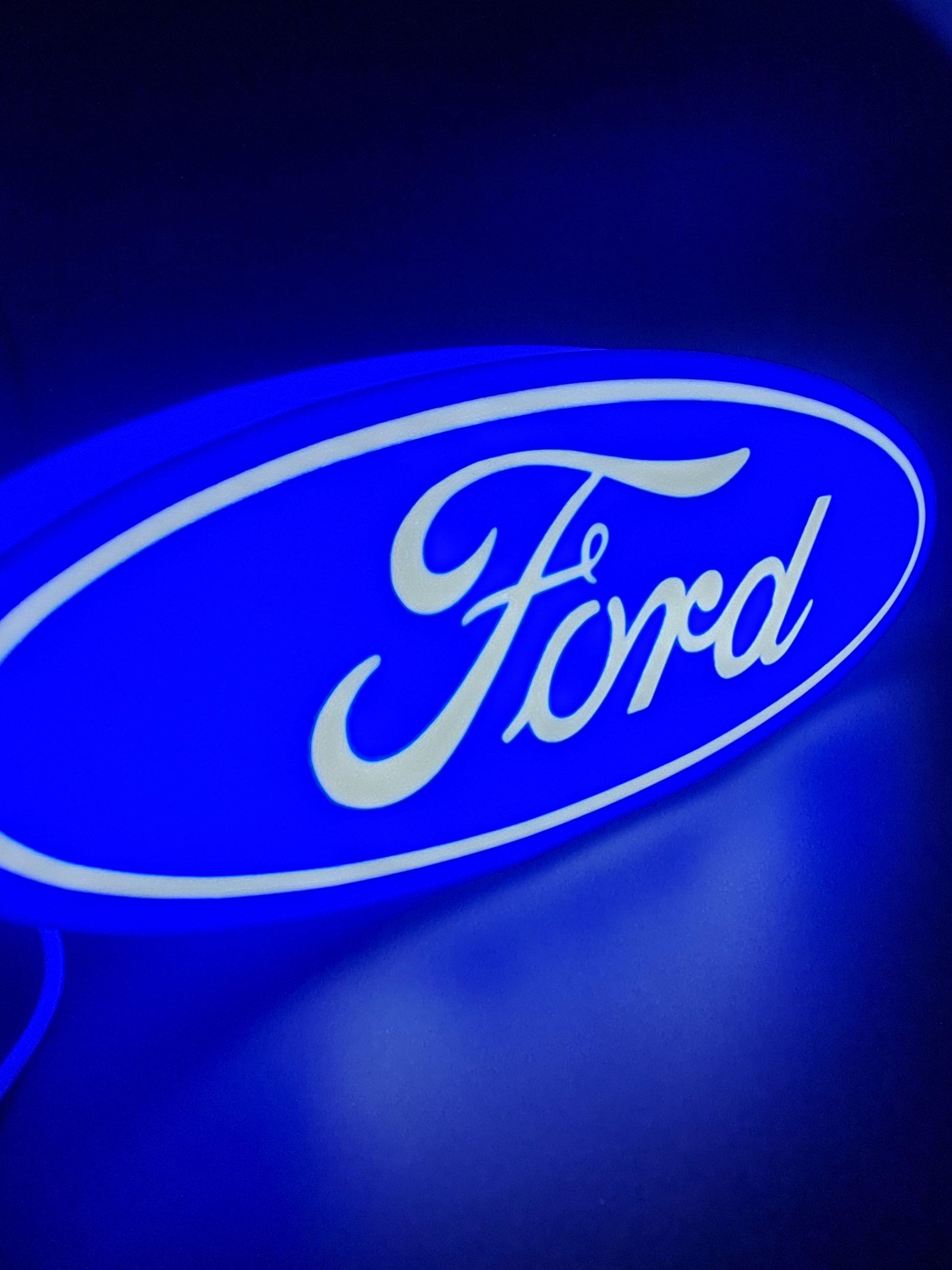 ford led light sign with illuminated logo viewed from side view