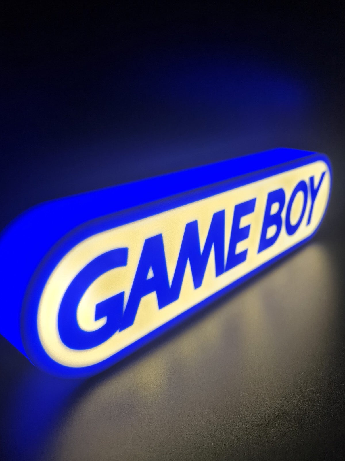 Gameboy LED light sign with illuminated logo viewed from side view
