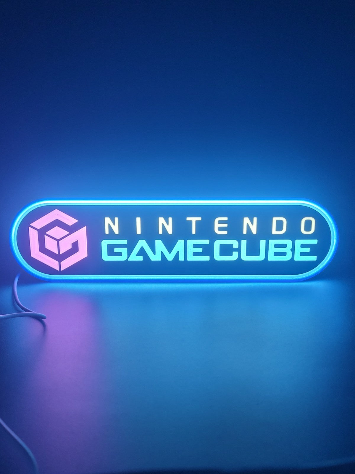 Gamecube LED light sign with illuminated logo viewed from straight on