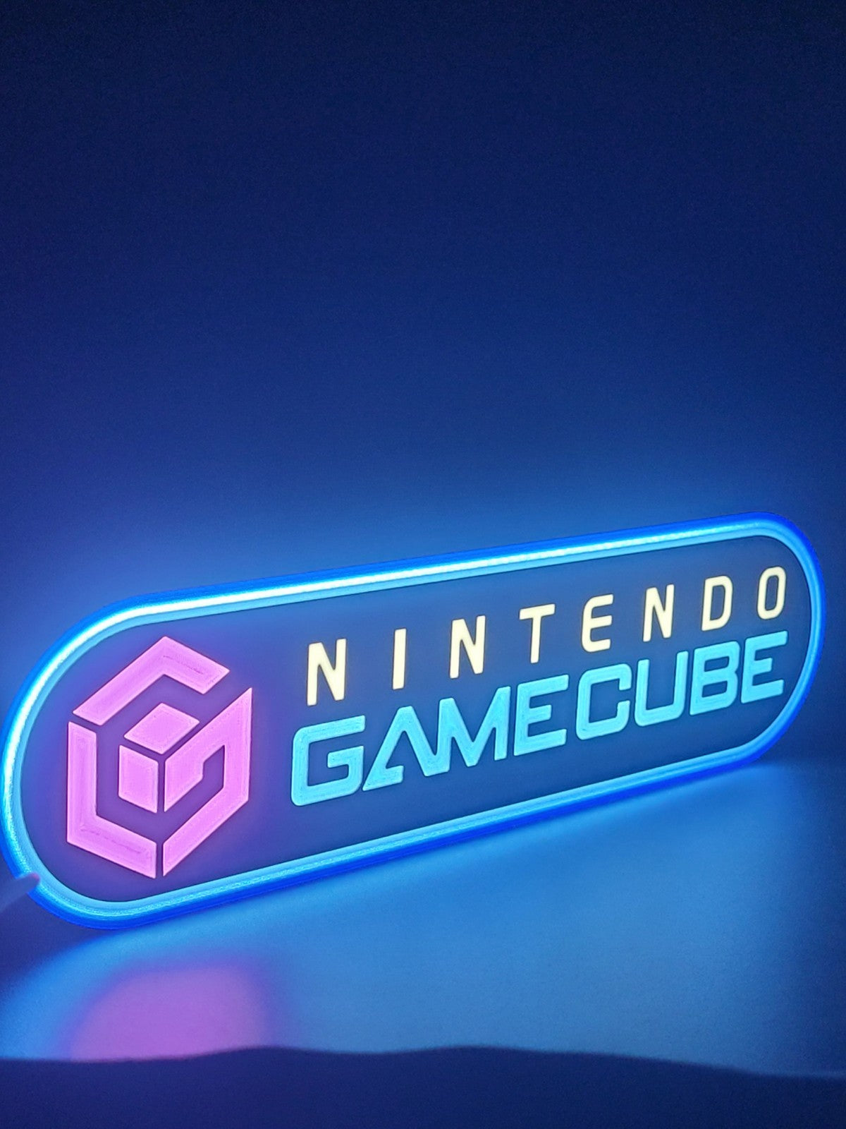 Gamecube LED light sign with illuminated logo viewed from side view