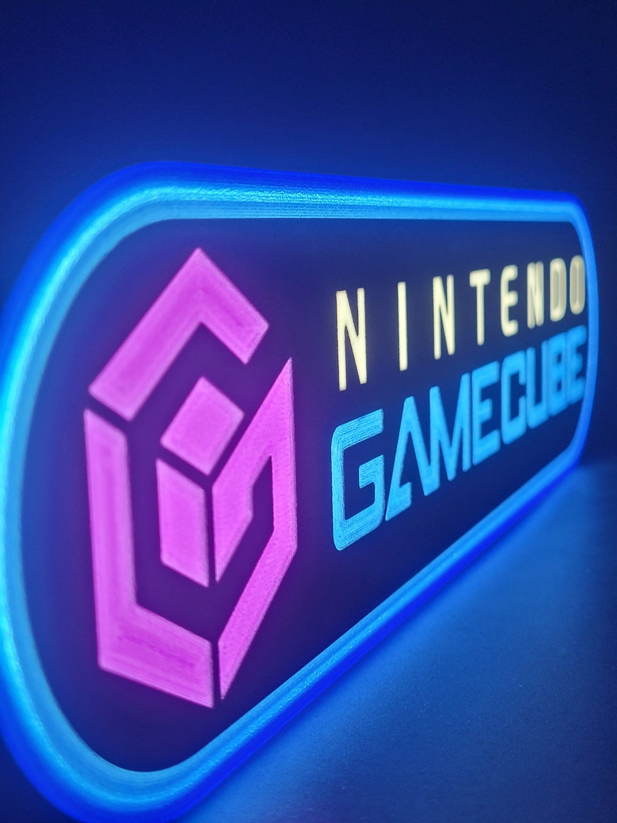Gamecube LED light sign with illuminated logo viewed from side view