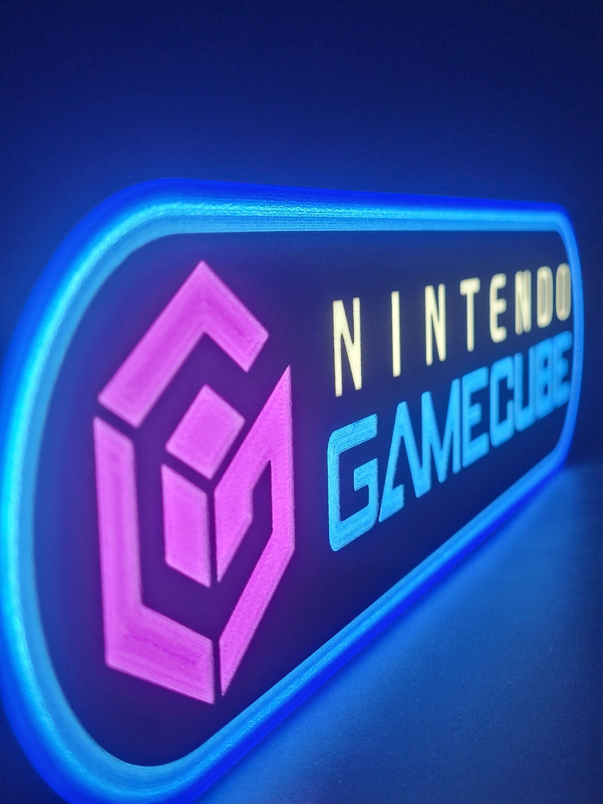 Gamecube LED light sign with illuminated logo viewed from side view