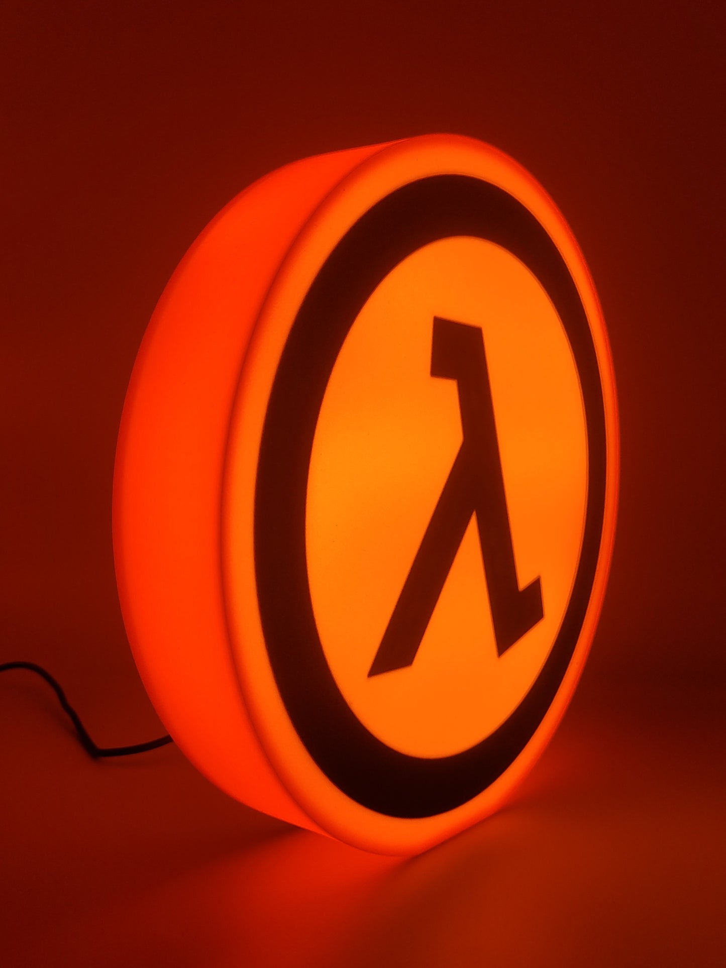 half-life led light sign with illuminated logo viewed from side 