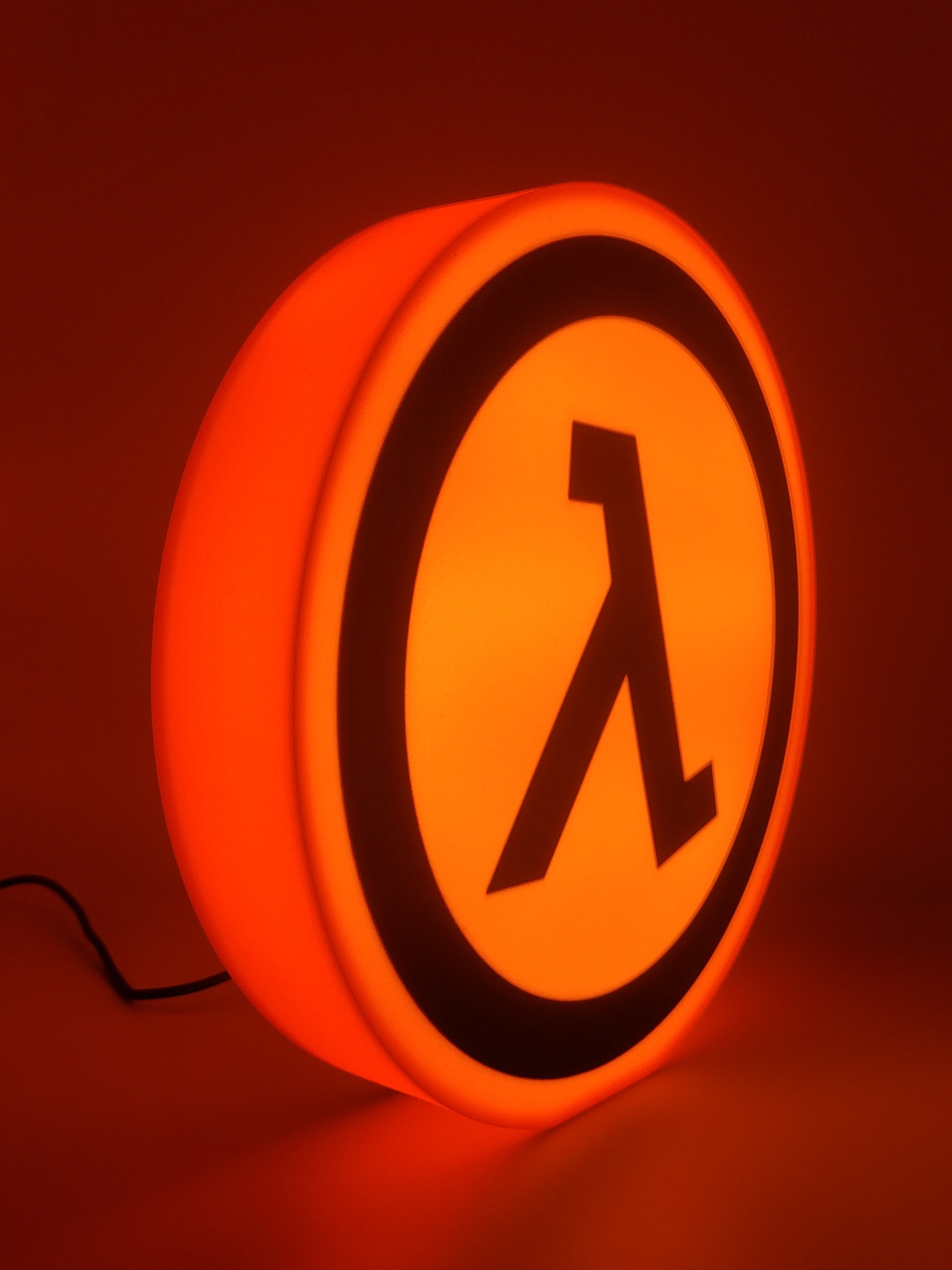half-life led light sign with illuminated logo viewed from side 