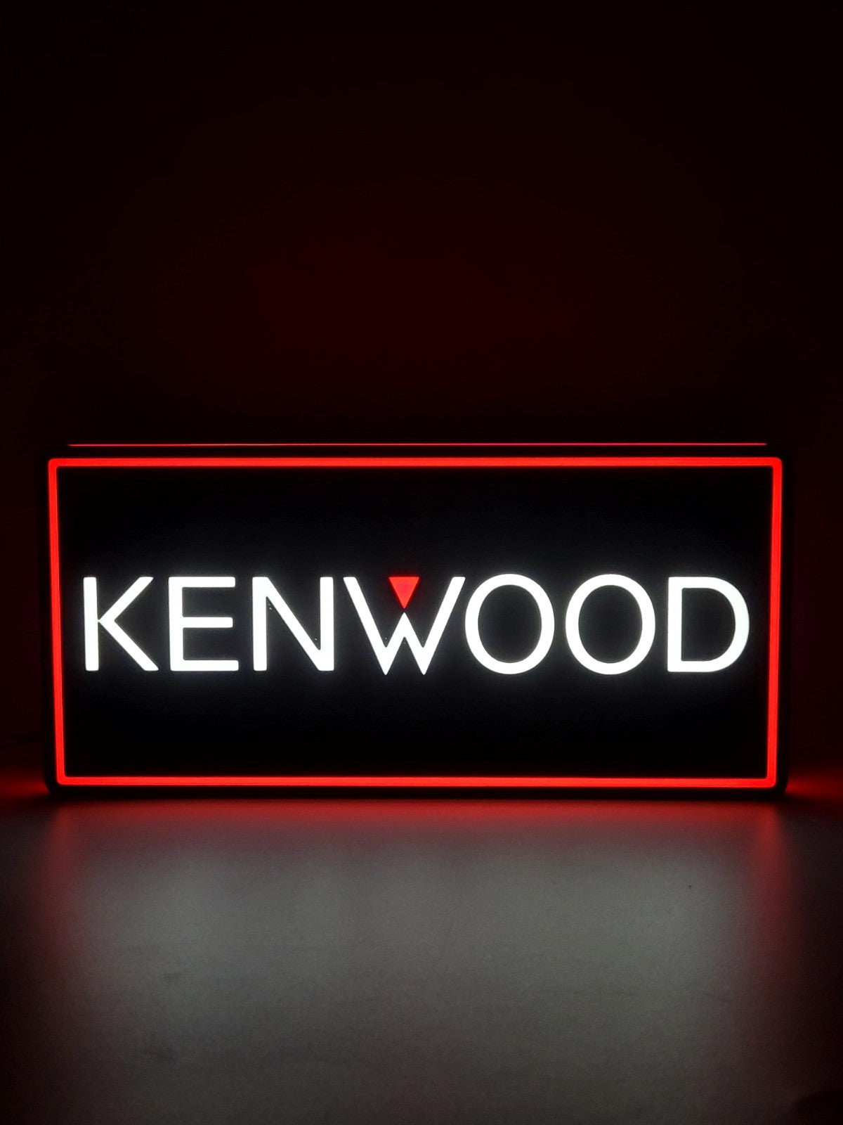 kenwood led light sign with illuminated logo viewed from straight on
