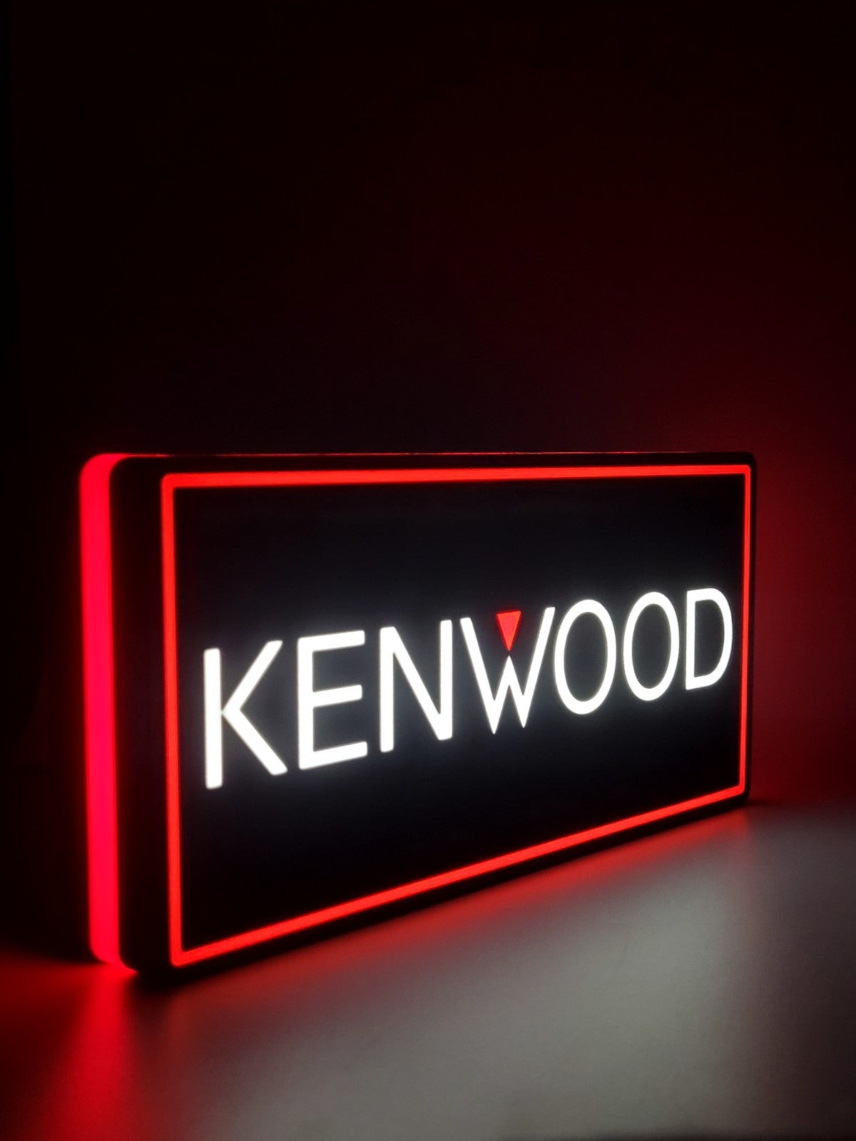 Kenwood led light sign with illuminated logo viewed from side view
