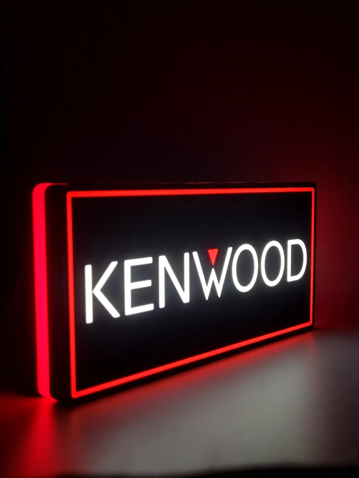 Kenwood led light sign with illuminated logo viewed from side view