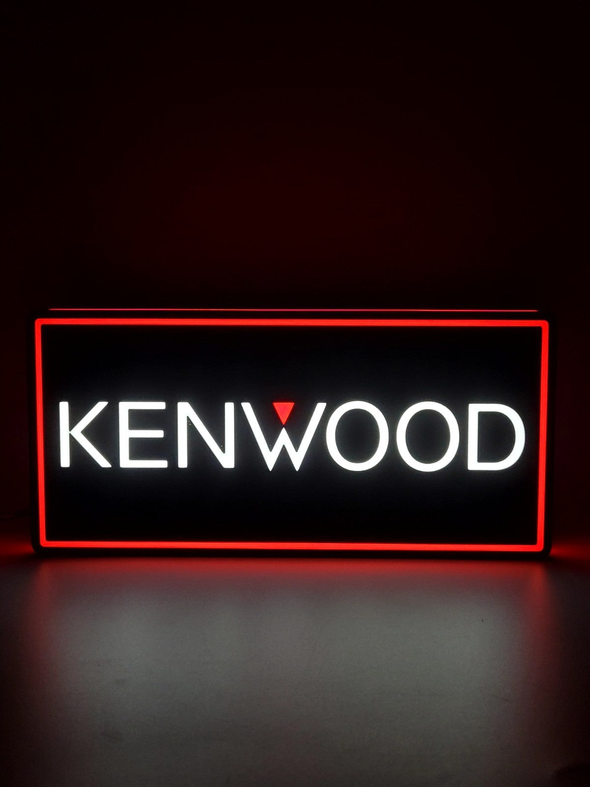 kenwood led light sign with illuminated logo viewed from straight on