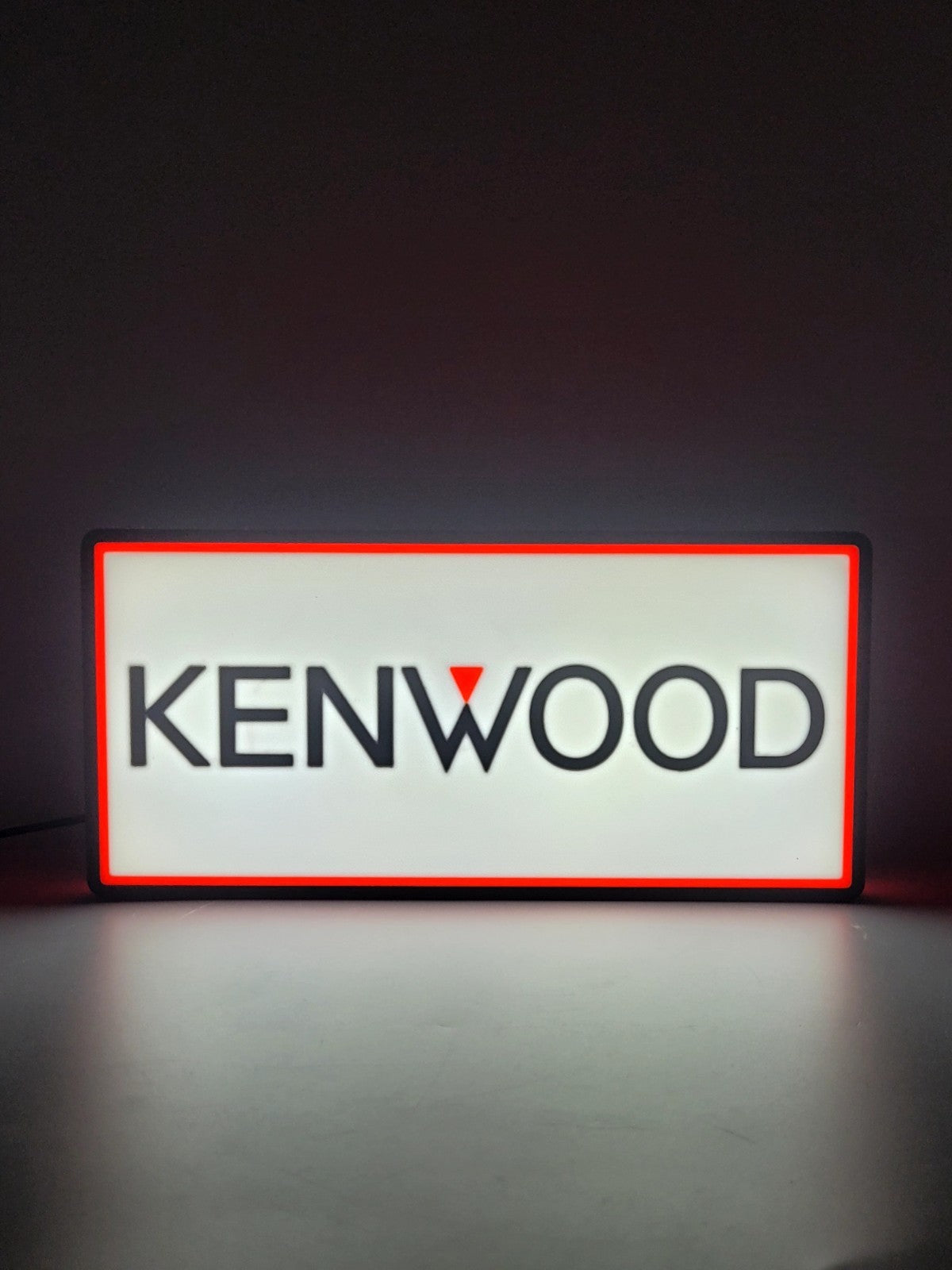 KENWOOD led light sign with illuminated logo viewed from straight on