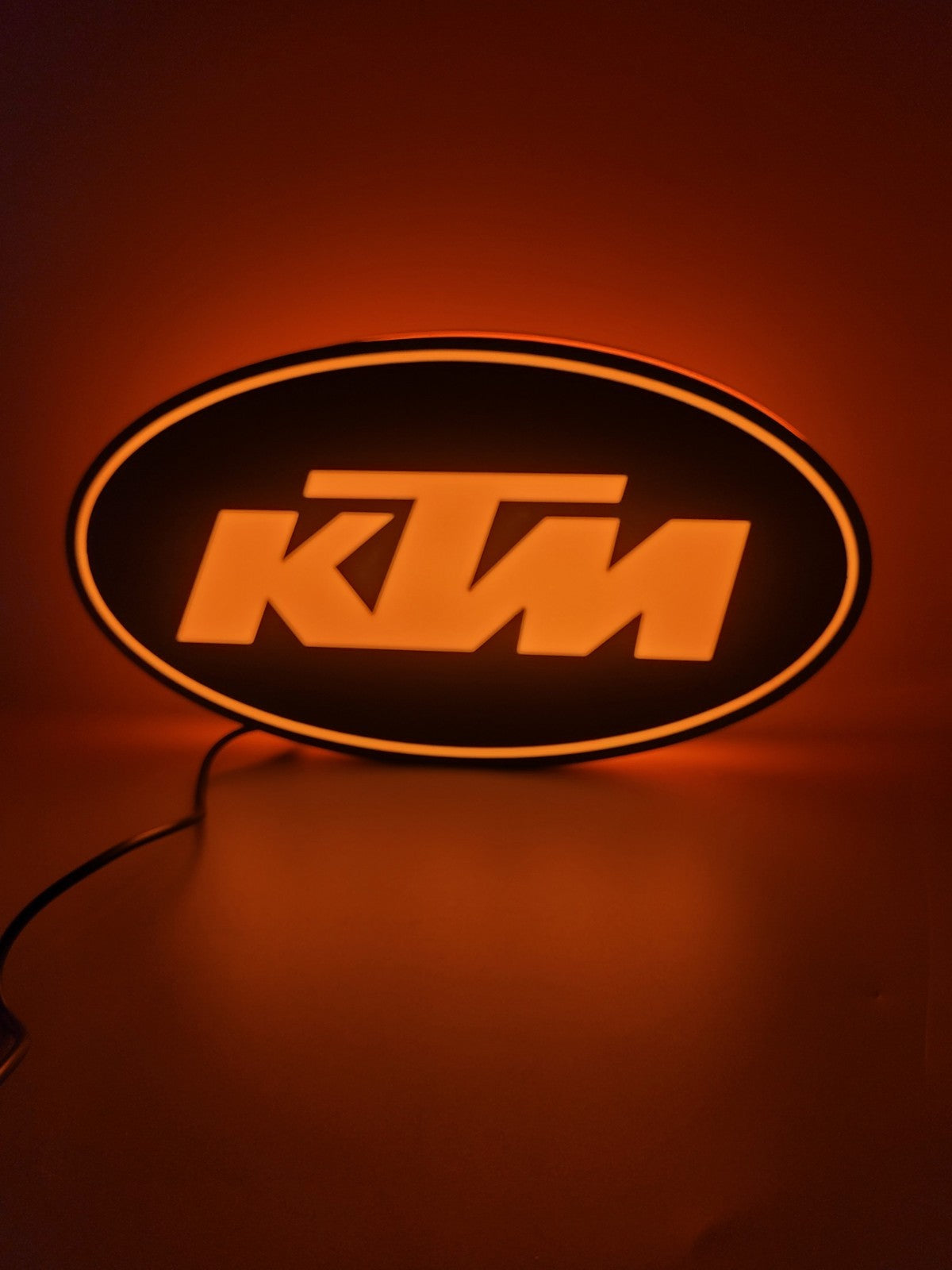KTM led light sign with illuminated logo viewed from straight on