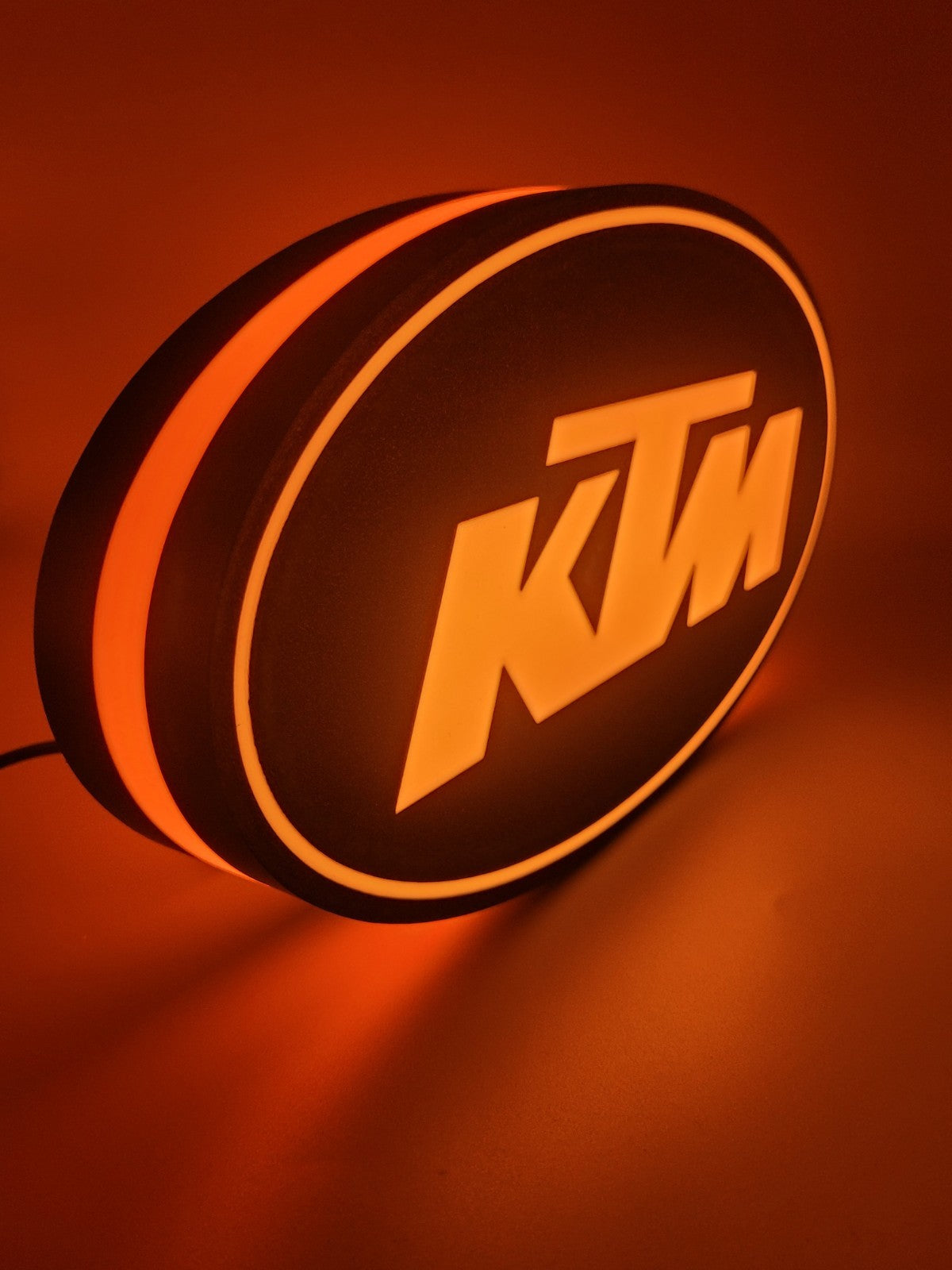 KTM led light sign with illuminated logo viewed from side view