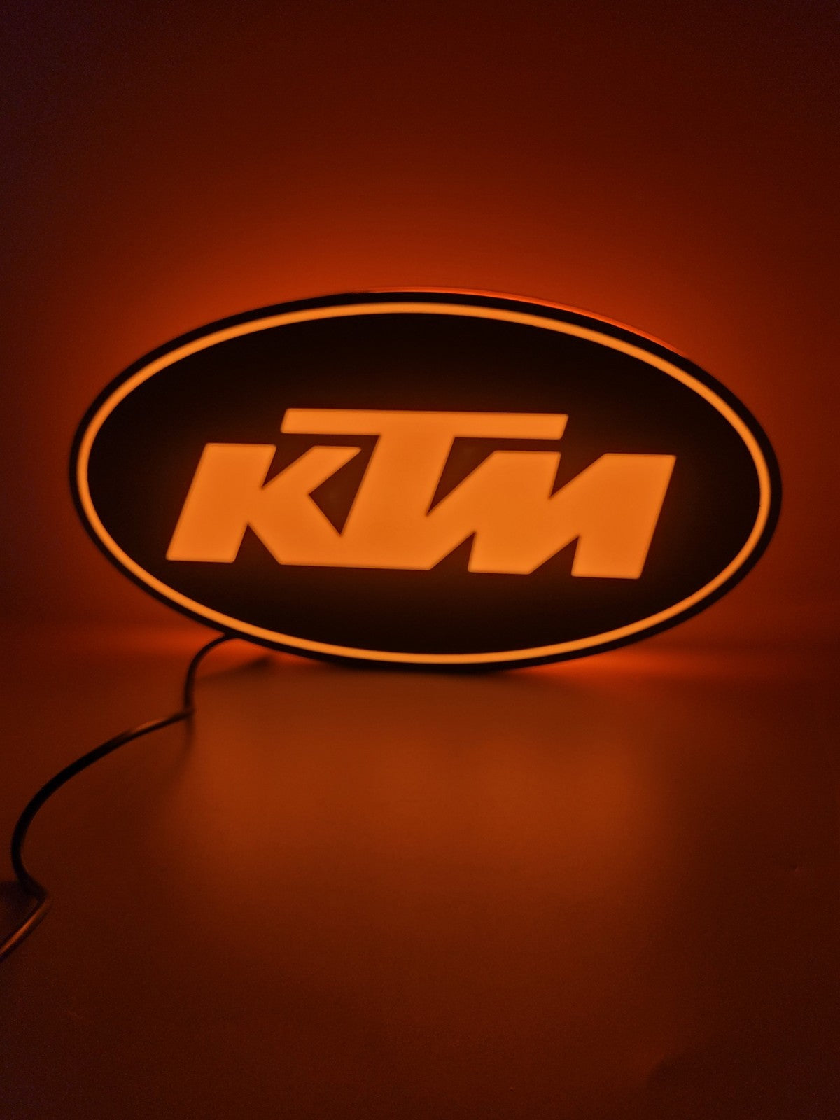 KTM led light sign with illuminated logo viewed from straight on
