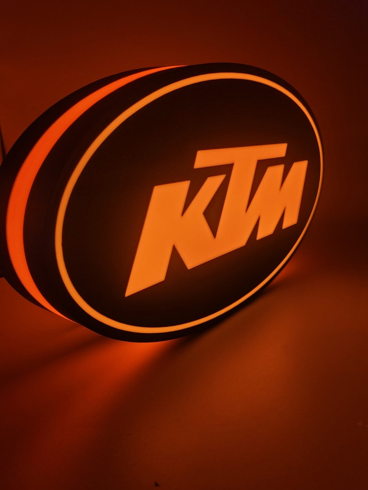 KTM led light sign with illuminated logo viewed from side view