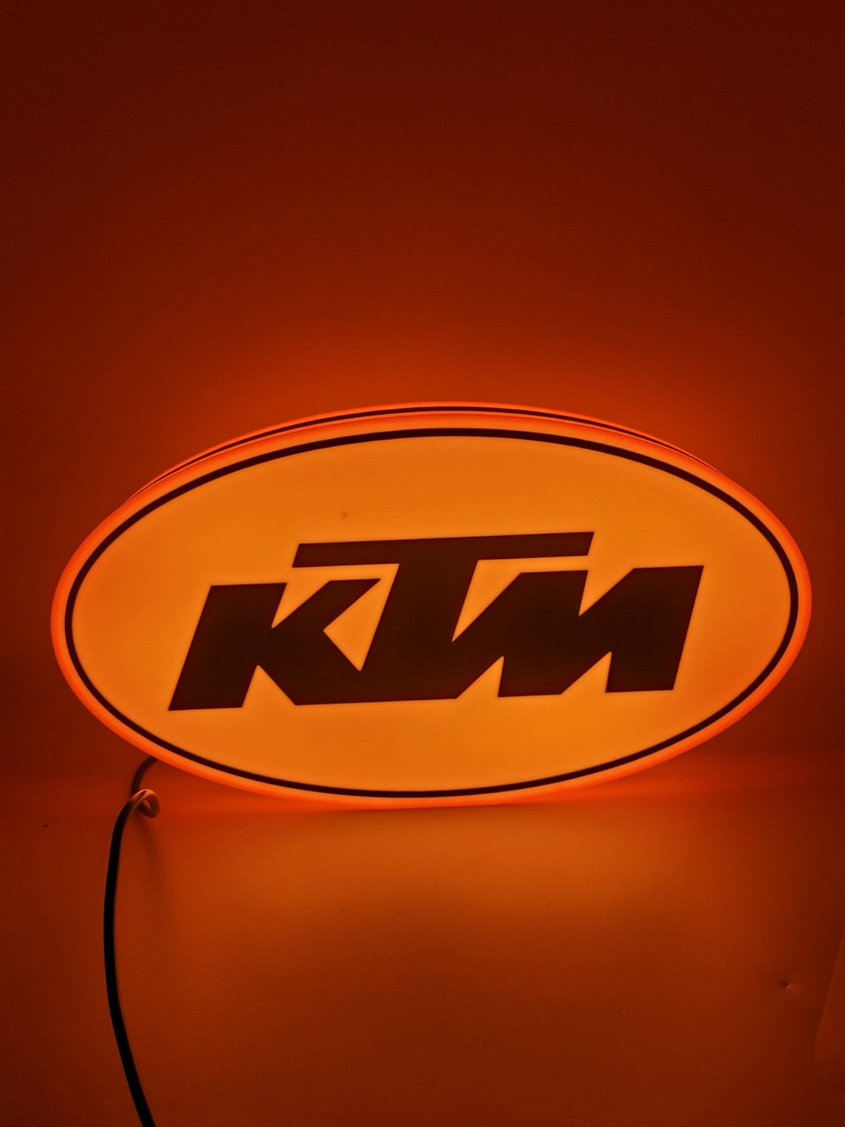 KTM led light sign with illuminated logo viewed from straight on
