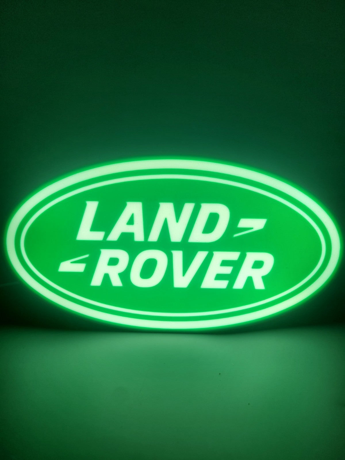 Land Rover LED light sign with illuminated logo viewed from straight on
