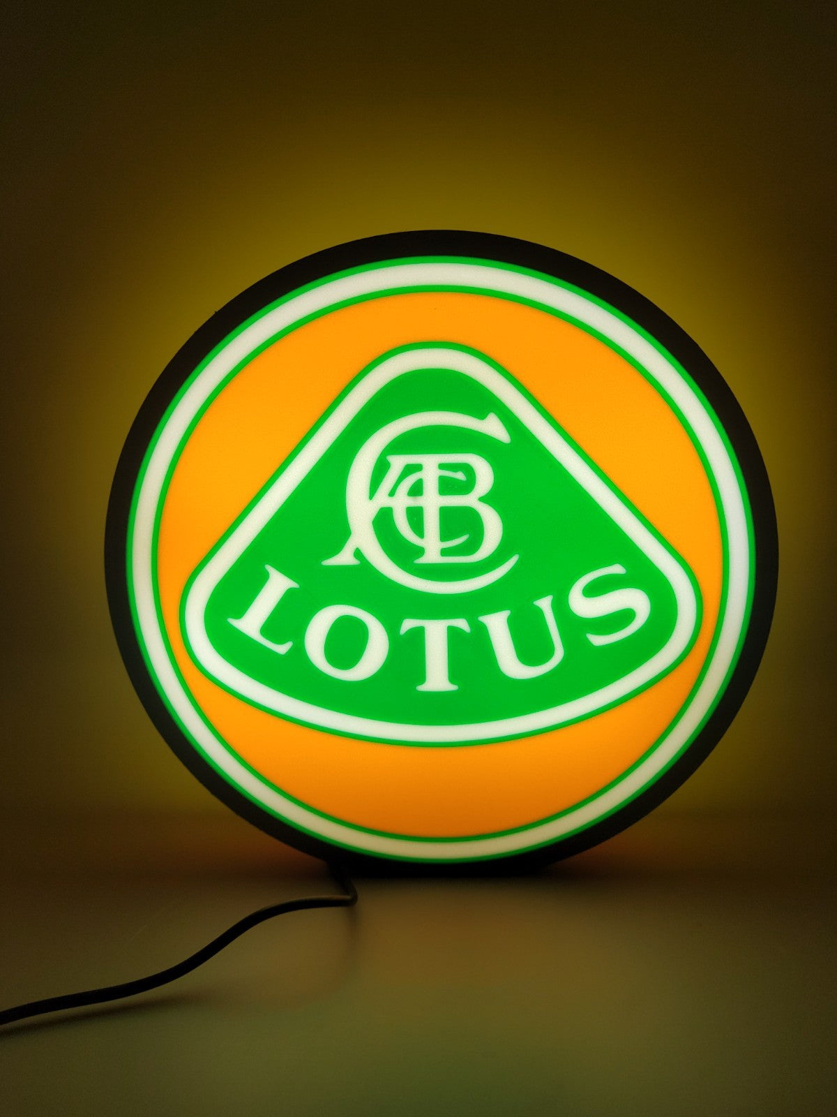 lotus led light sign with illuminated logo viewed from straight on