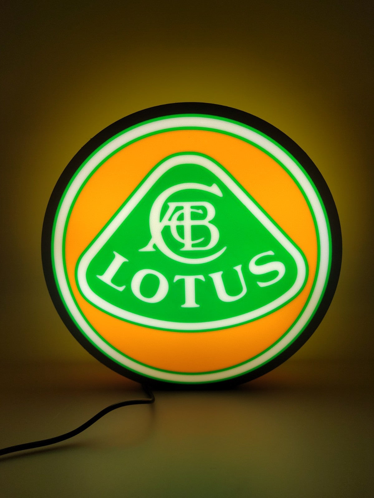 lotus led light sign with illuminated logo viewed from straight on
