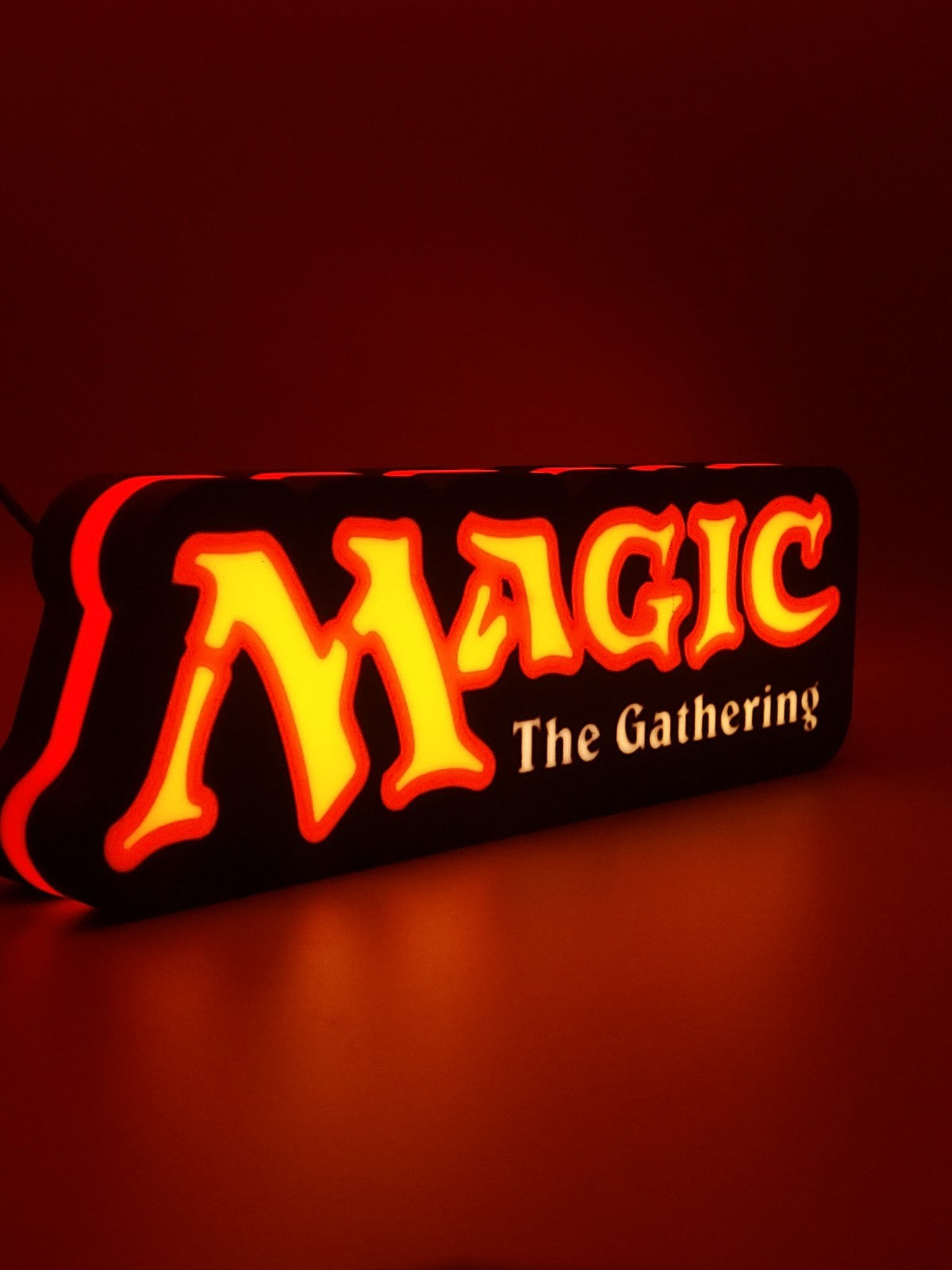 MAGIC THE GATHERING led light sign with illuminated logo viewed from side view