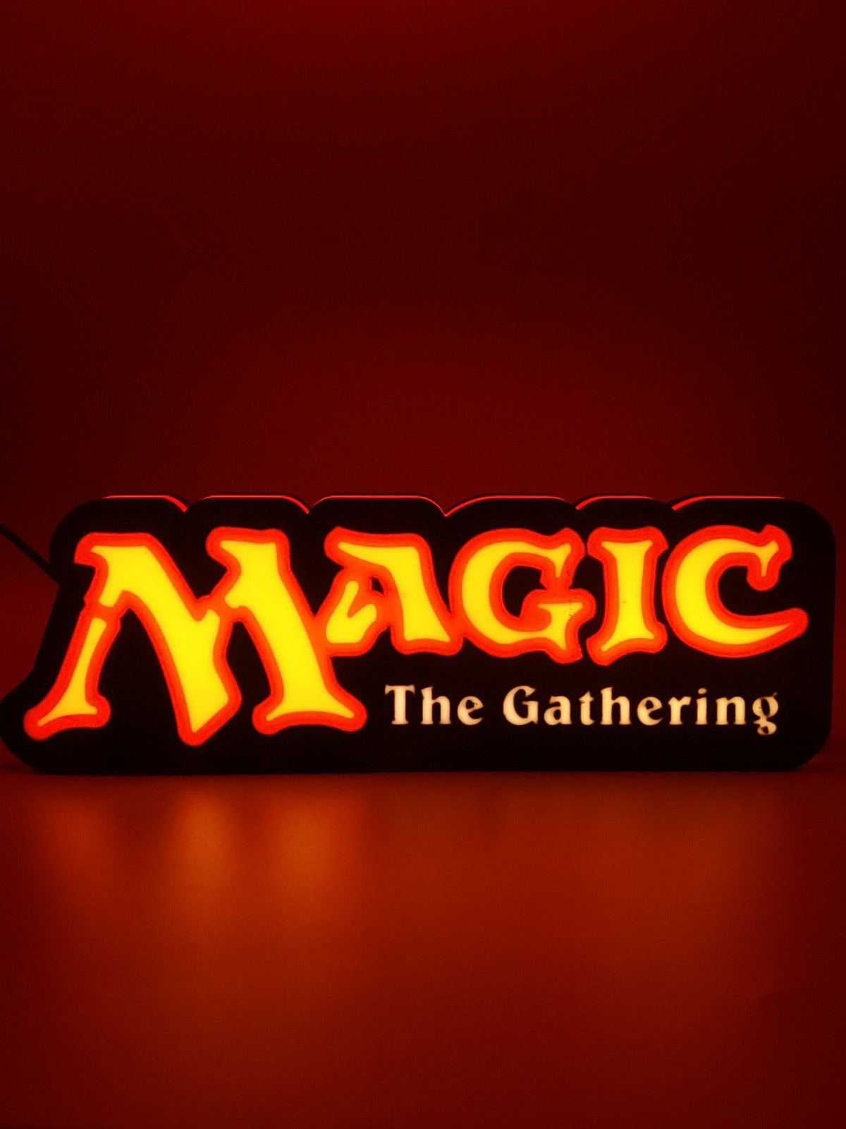 MAGIC THE GATHERING led light sign with illuminated logo viewed from straight on