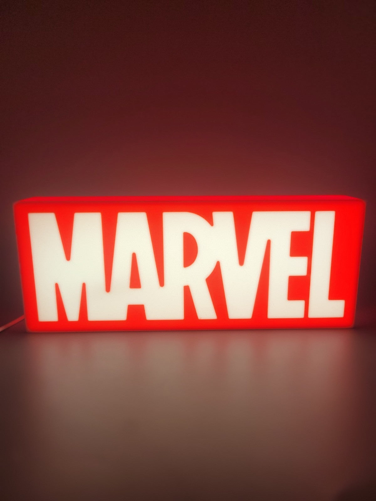 Marvel LED light sign with illuminated logo viewed from straight on