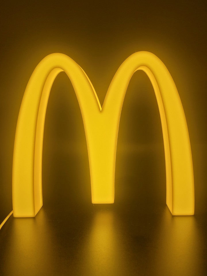 Mcdonalds LED light sign with illuminated logo viewed from straight on