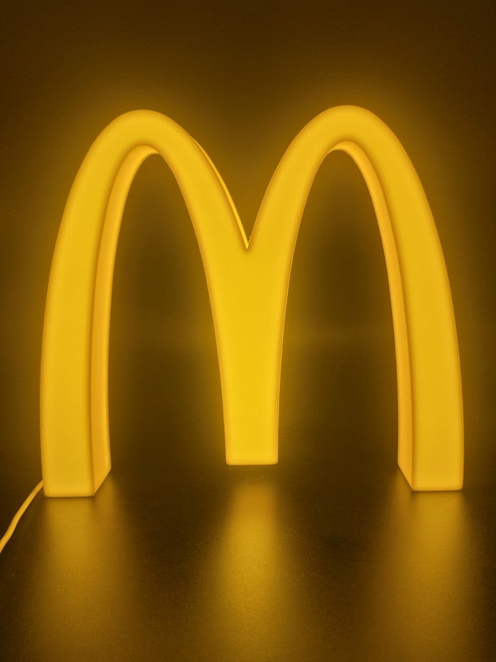 Mcdonalds LED light sign with illuminated logo viewed from straight on