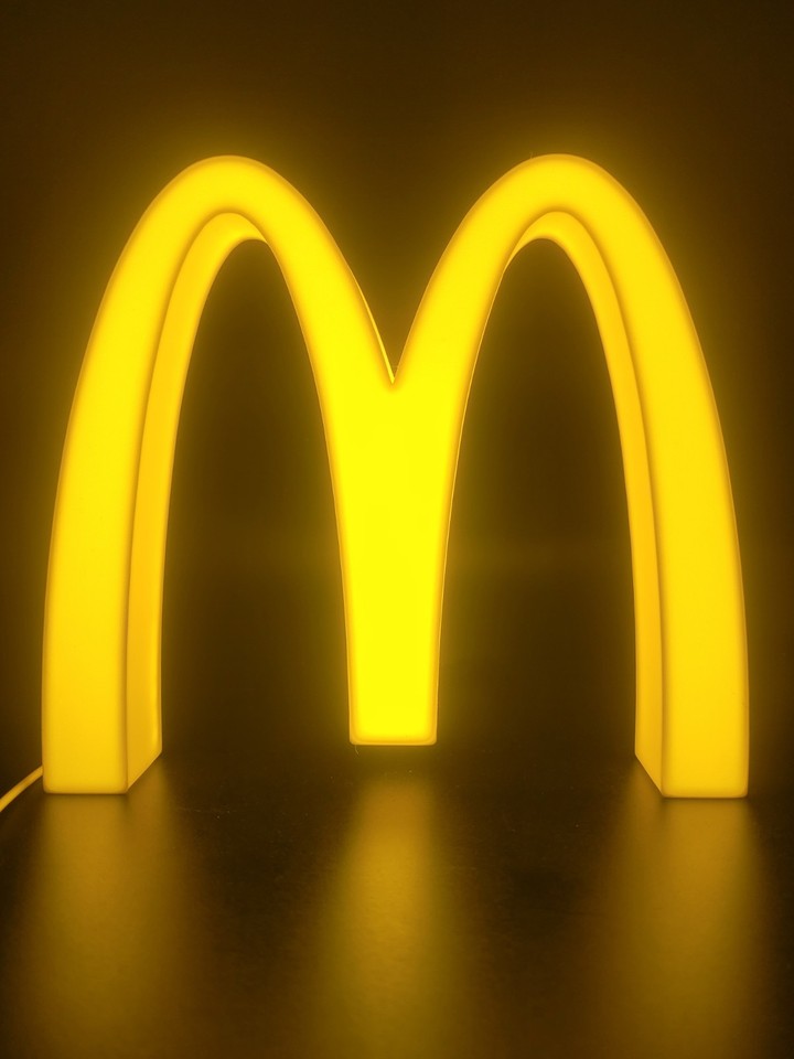 Mcdonalds LED light sign with illuminated logo viewed from straight on