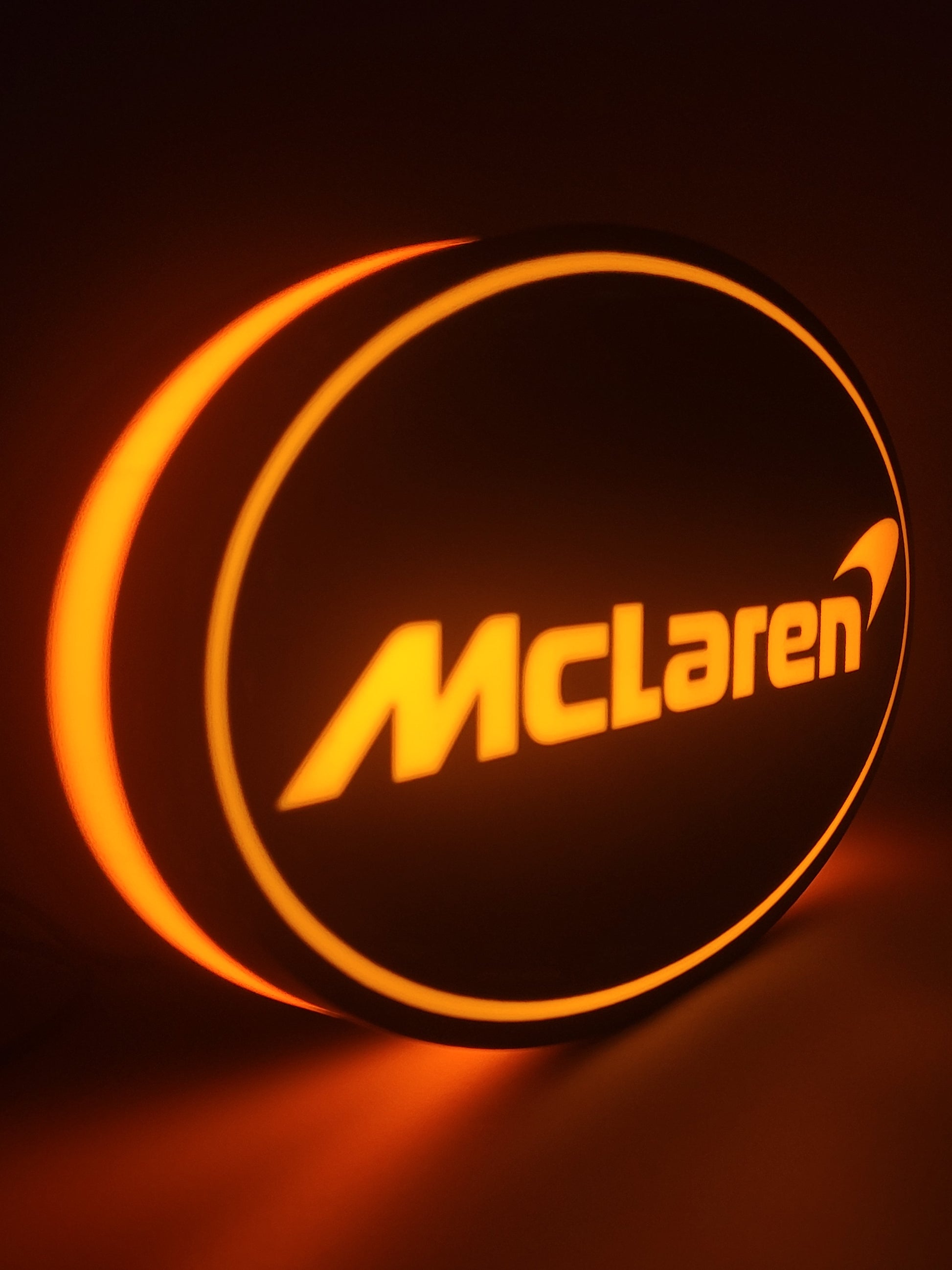 mclaren led light sign with illuminated logo viewed from side view