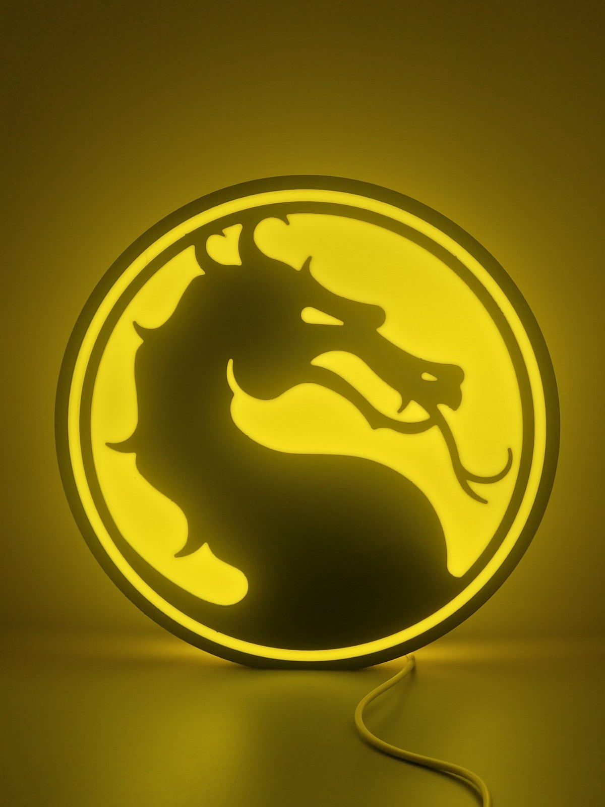 Mortal Kombat led light sign with illuminated logo viewed from straight on