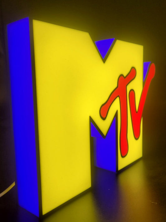 Mtv led light sign with illuminated logo viewed from side view