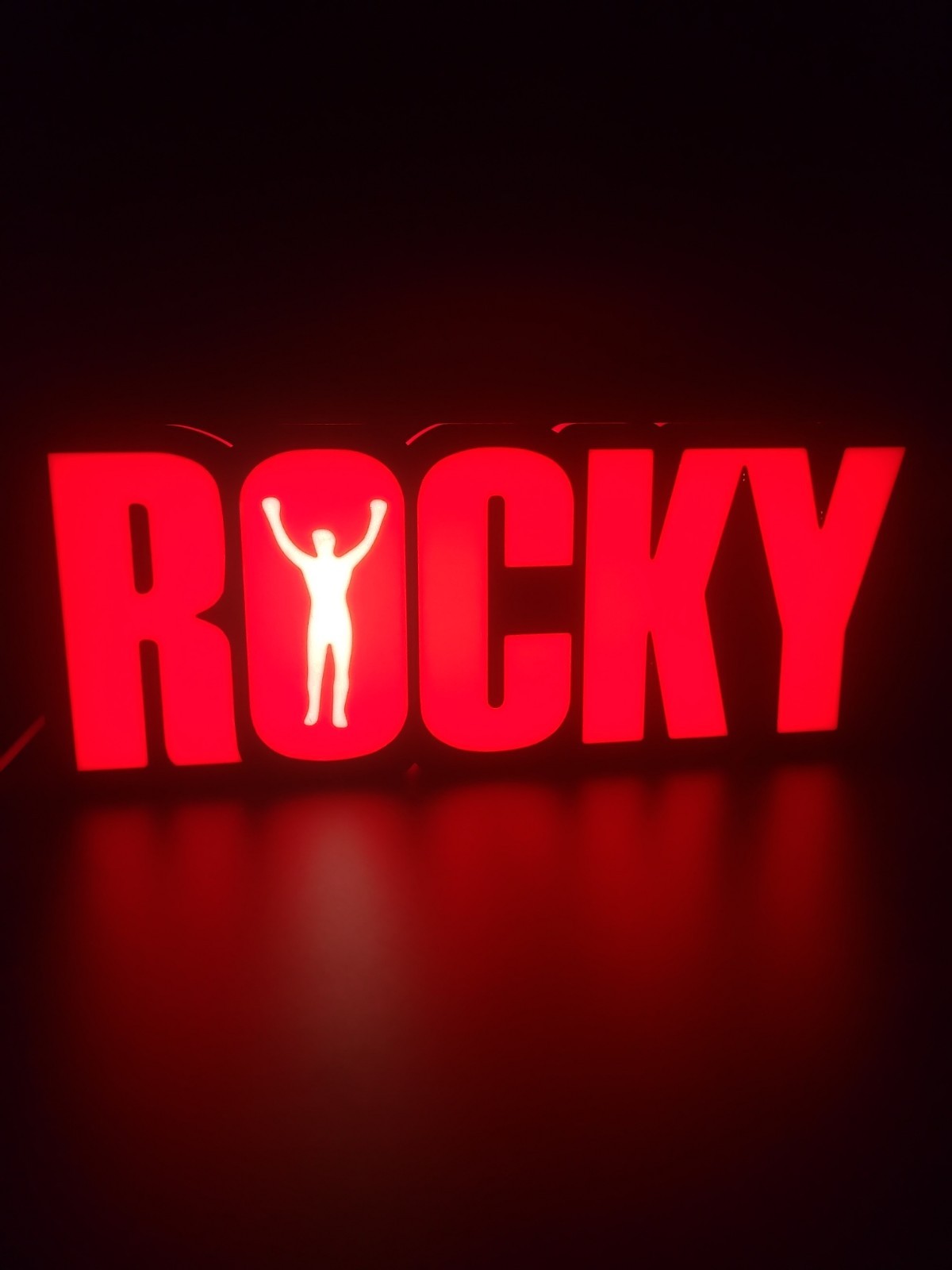 ROCKY led light sign with illuminated logo viewed from straight on