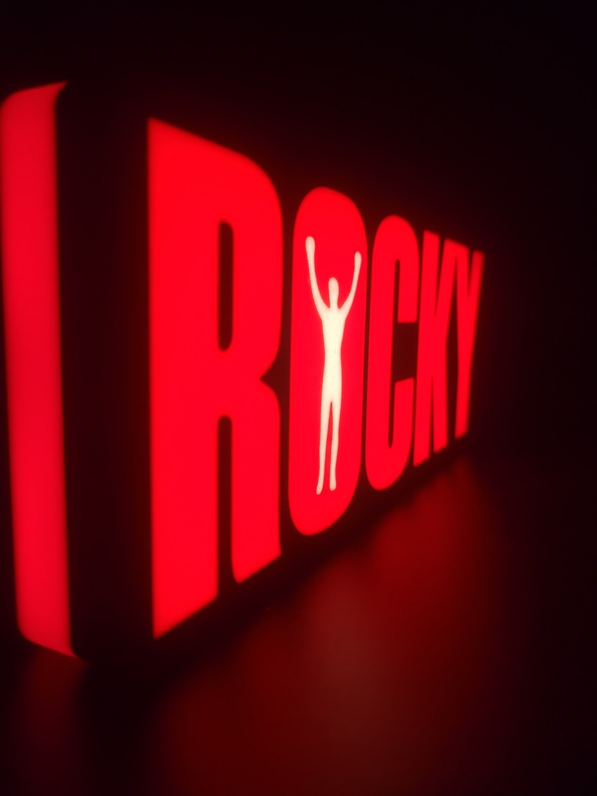 ROCKY led light sign with illuminated logo viewed from side view
