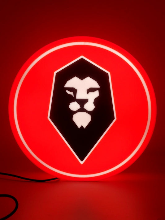 Salford FC led light sign with illuminated logo viewed from straight on
